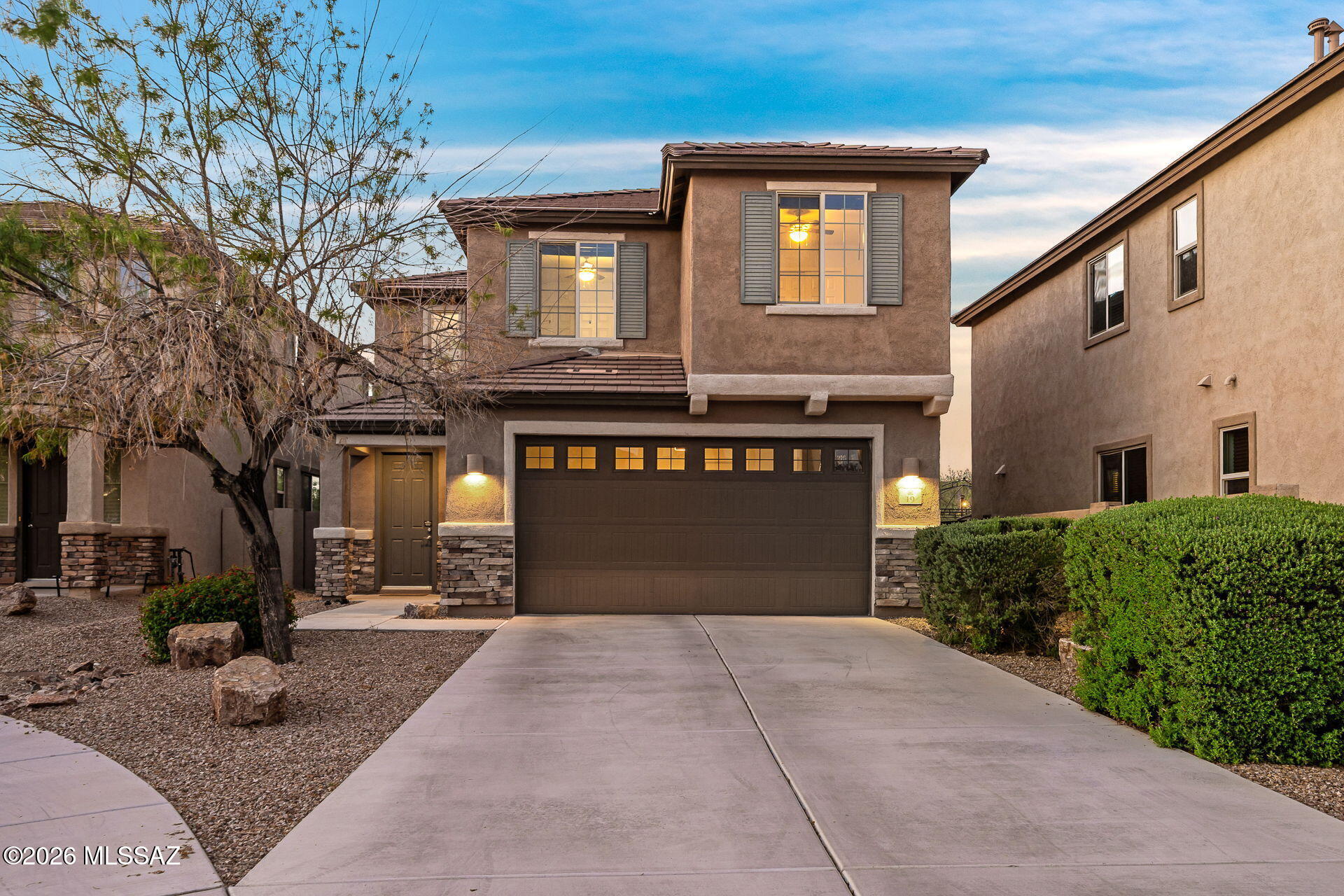 Beautiful two story home in the desirable community of Rancho Sahuarita featuring 4 bedrooms, a den, and a spacious loft. The open concept floor plan offers a large kitchen island perfect for entertaining. Enjoy the beautifully landscaped backyard with a gas fire pit, ideal for relaxing Arizona evenings. Conveniently located near shopping, dining, parks, and community amenities. A must see!