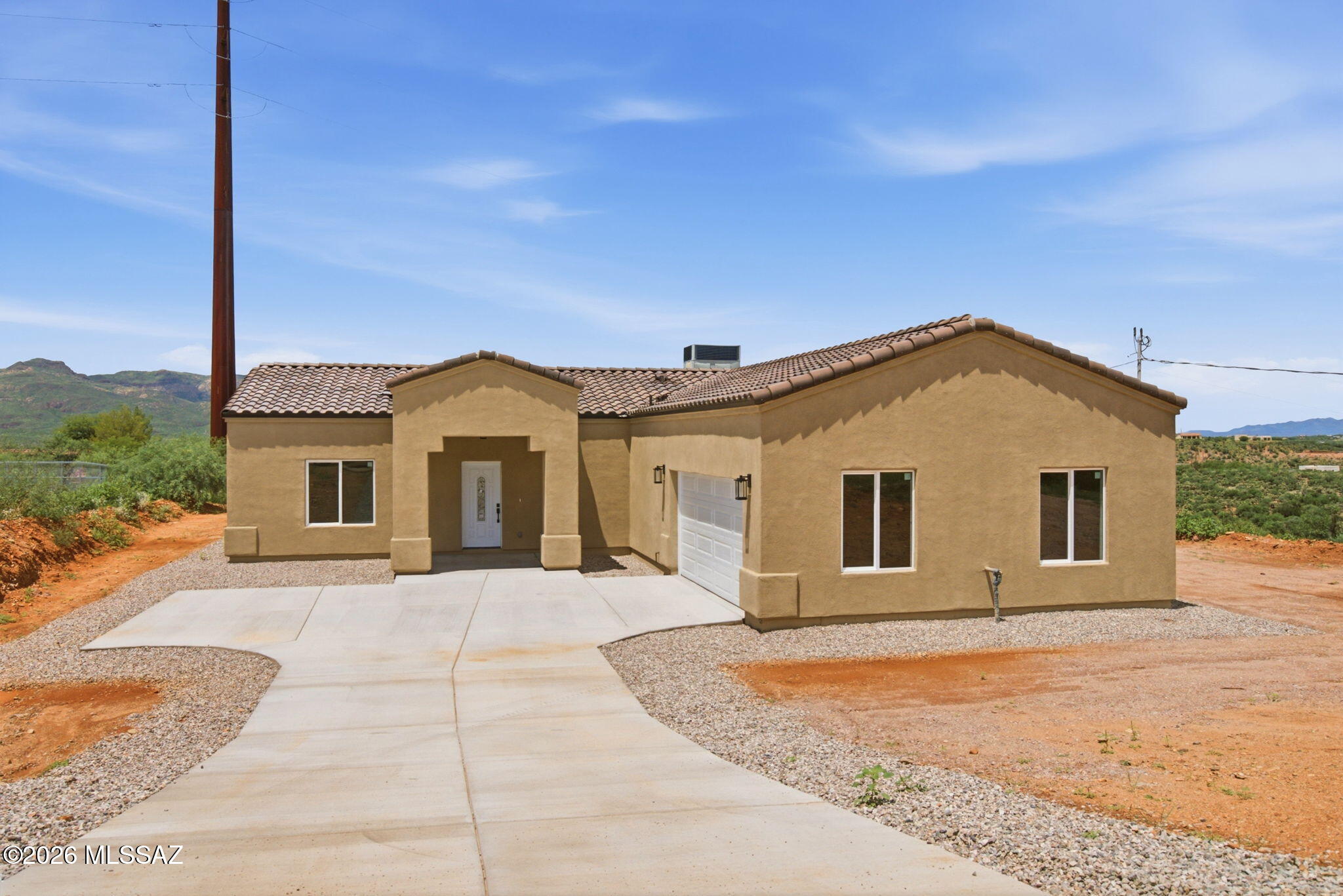 This beautifully designed 3-bedroom, 2-bathroom home offers 1,752 square feet of thoughtfully planned living space on a spacious 0.75-acre lot. The heart of the home is the impressive kitchen, featuring handcrafted cabinetry that adds warmth, character, and quality craftsmanship. A durable tile roof enhances the home's timeless appeal, while the generous lot provides plenty of room to enjoy the outdoors, entertain, or create your own backyard retreat. With comfortable living spaces, quality details, and ample outdoor space, featuring an extended covered patio, this home offers the perfect blend of style, functionality, and room to make it your own.