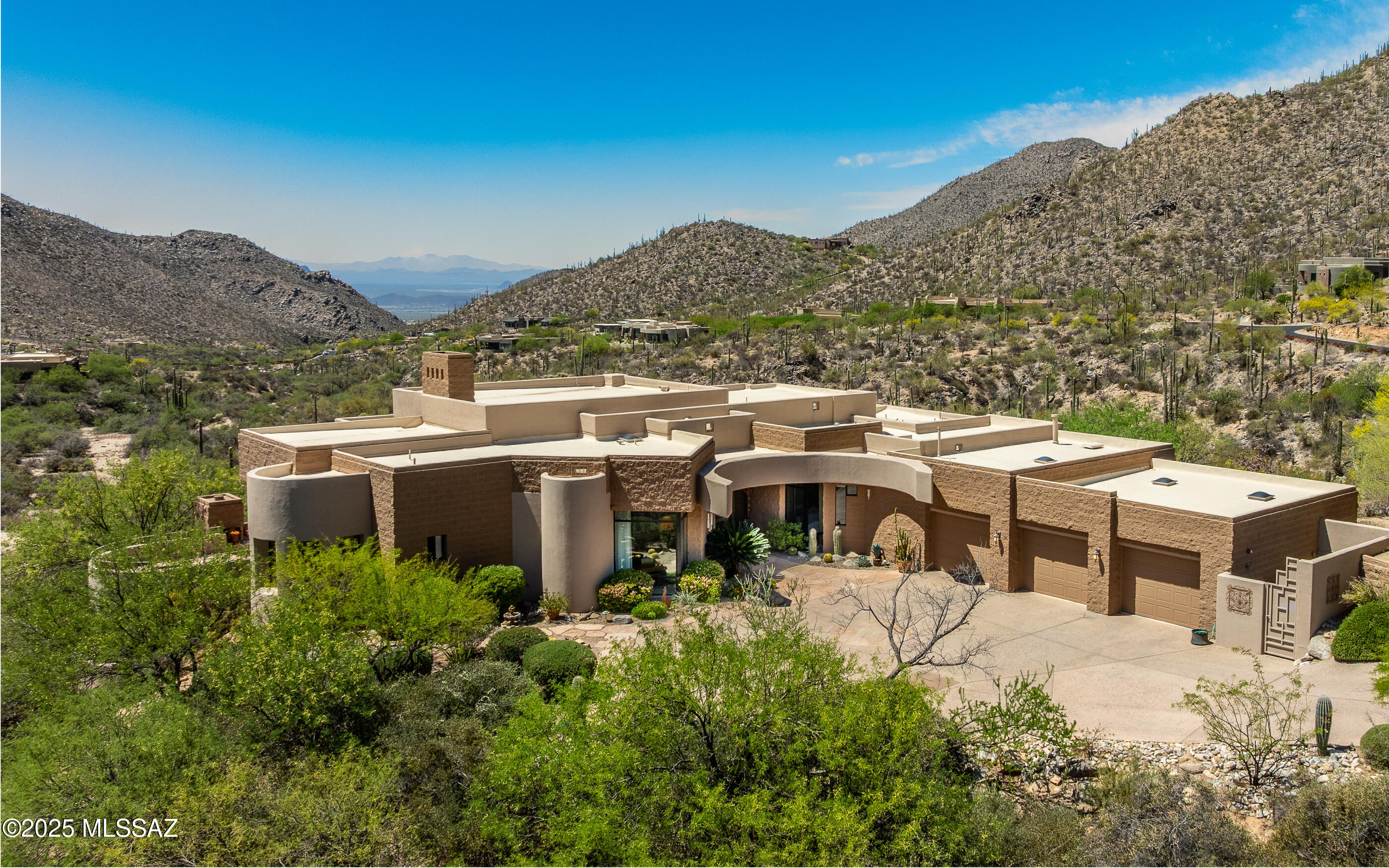 Named ''The Peninsula Homestead'' this custom masonry/stucco Canyon Pass residence sits in complete privacy - alone, surrounded by rock croppings and a natural wash - out on a peninsula of two combined lots - now on 4.8 acres of seclusion.  Multiple decks provide panoramic viewing of  rocky hillsides and wide, deep wash, mesmerizing canyon views & sunset glowing skies & tinted mountainsides!  Enjoy a negative edge pool, private in-ground spa outside primary bedroom that sits out on it's own private peninsula, and wrap-around relaxation & viewing decks for panoramic nature enjoyment. Soaring ceilings, floor to ceiling windows & an oversized 3 car garage w/extra storage rooms. Home is available furnished if desired on separate BOS. Private & stunning location on a very large, quiet lot.