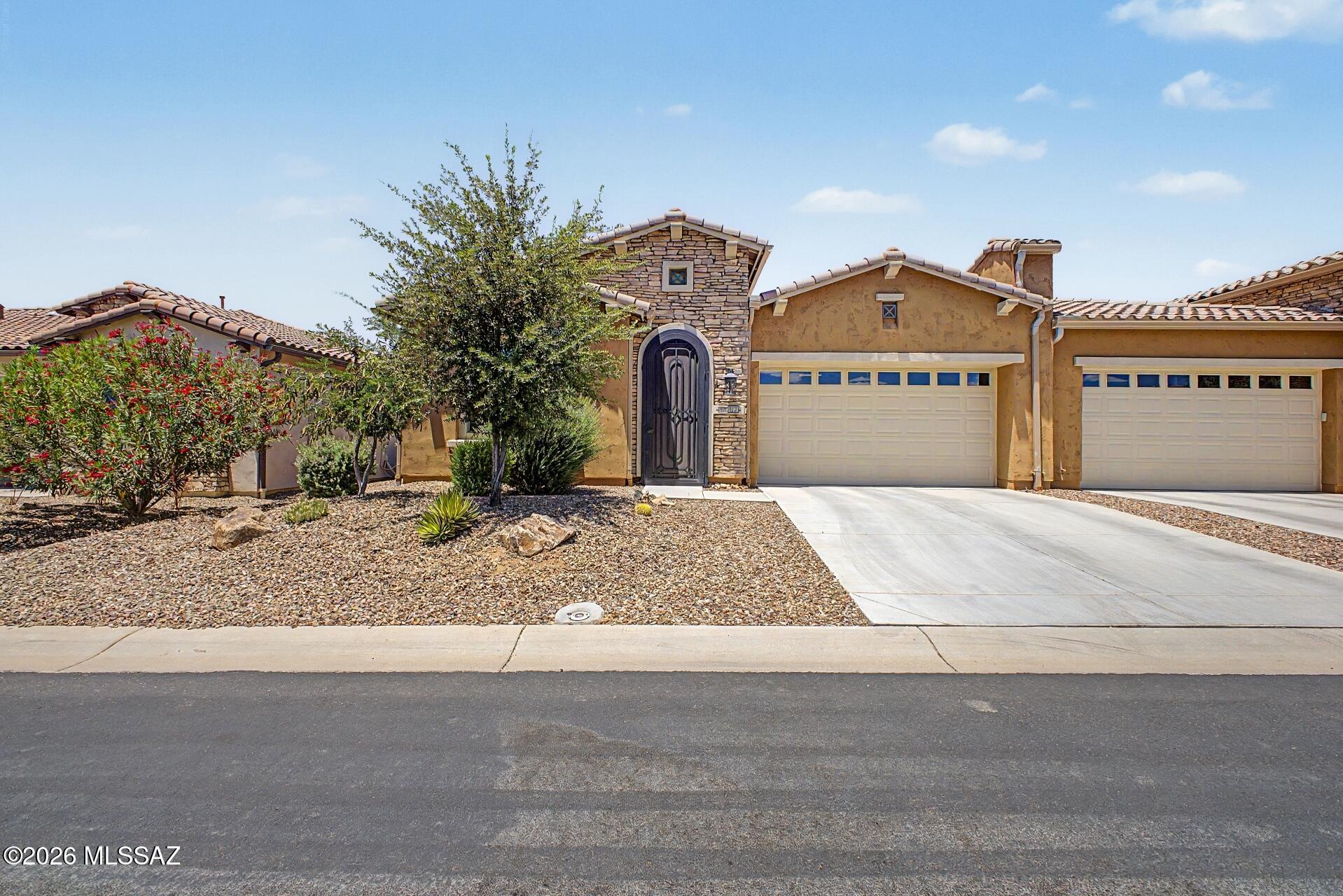 Experience elevated desert living in one of Southern Arizona's premier active adult resort communities. This highly upgraded home showcases designer flooring, premium fixtures, custom lighting, and exceptional attention to detail throughout. Enjoy a fully enclosed backyard for added privacy and convenience, while exterior home maintenance is included, allowing for a true lock-and-leave lifestyle.

Beyond the home, residents enjoy breathtaking mountain vistas, a championship golf course, resort-style pools, fitness and wellness facilities, pickleball and tennis courts, restaurants, clubhouse amenities, arts and technology centers, walking trails, and an active social calendar filled with clubs and events. Luxury, convenience, and an unmatched lifestyle come together in this exceptional of