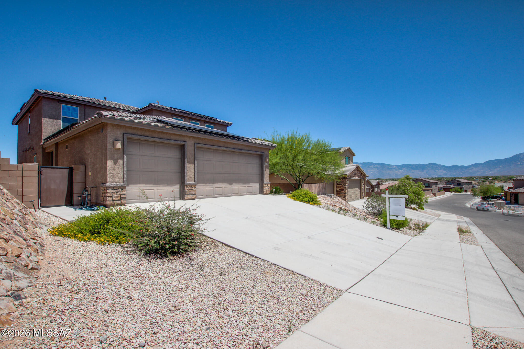 This spacious 3,005 sq ft home has LOTS to offer! 4 bedrooms and 4 bathrooms designed for comfort and flexibility. The property features three covered parking spaces, a full kitchen, dual vanity sinks, two step in showers, and granite counter tops! Inside, generous living areas and well-planned bedrooms create a welcoming layout for families or guests. Peaceful desert setting with beautiful views, blending privacy with convenience, and offering plenty of space both indoors and out for the lifestyle you want.