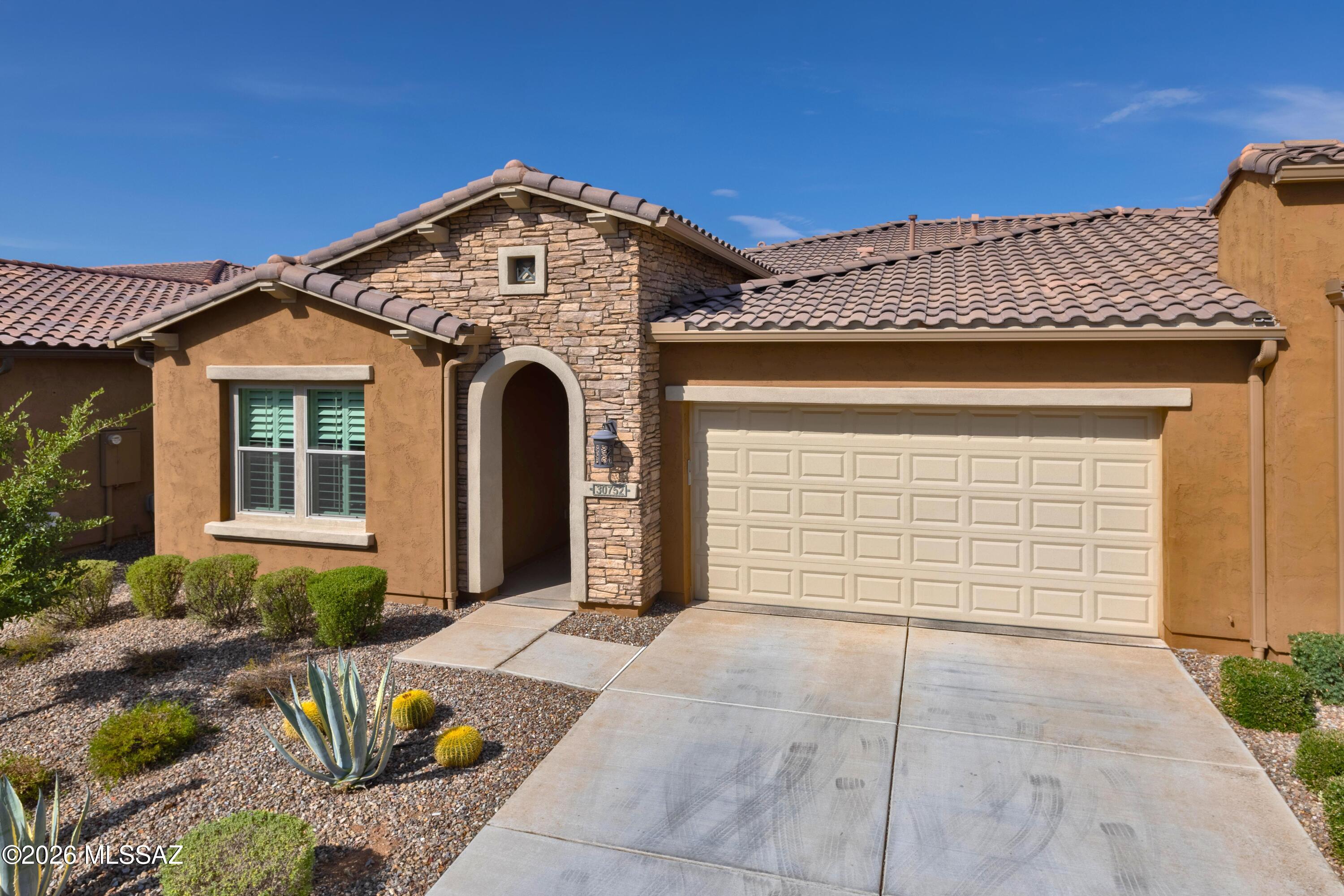 COMES FULLY FURNISHED! FURNITURE, BEDDING, DISHES, TV'S, BBQ'S, POTS & PANS - EVERYTHING THAT IS CURRENTLY IN THE VILLA. This is a beautiful 1707 Sq. Ft. Viva Villa Exterior Design __ built in 2020 that looks over a gorgeous Arroyo with a walking path.  This home includes 2-Bedroom En Suites, Great Room w/Media Alcove, Dining Area, Spacious Den, Grand Kitchen Island w/Walk-In Pantry, Separate Laundry Room, 274 Sq. Ft. Covered Outdoor Living Space, Deel 2-Car Garage, 9' & 10' Ceilings, and a 214 Sq. Ft. Enclosed Private Courtyard with gate.  The buyer has the incredible option of buying this unit and the attached unit as both are owner by the same individual = truly an investor's dream!