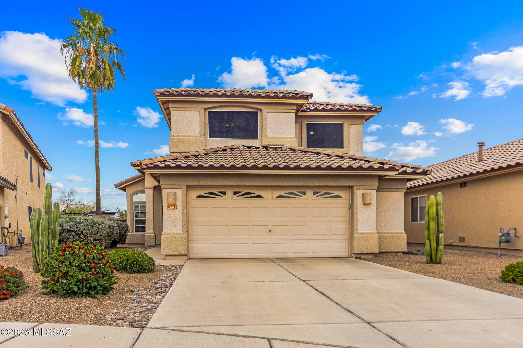 Rare 4 bed/2.5 bath 2-story home in the sought after NW community of the Upper Bluffs! This SUPER CLEAN and well-maintained home boasts a NEW ROOF and updated bathrooms, as well as a low maintenance backyard with no homes behind. Enter into a large living area with vaulted ceilings and TONS of windows to bring in all the natural light. The chef's kitchen includes granite countertops and all appliances, and has a small family room connected (or can be a HUGE country kitchen). Upstairs you will find 4 spacious bedrooms including a primary suite with large walk-in closet, soaking tub and separate shower. There is a neighborhood trailhead just down the street that accesses 100 acres of pristine Sonoran desert for your hiking pleasure; and it also leads to the community park complete with grassy and picnic areas, a basketball court, and a play area for children. Close to award winning Oro Valley schools, shopping, restaurants and more, it is the perfect location for a home base close to all your favorite destinations!