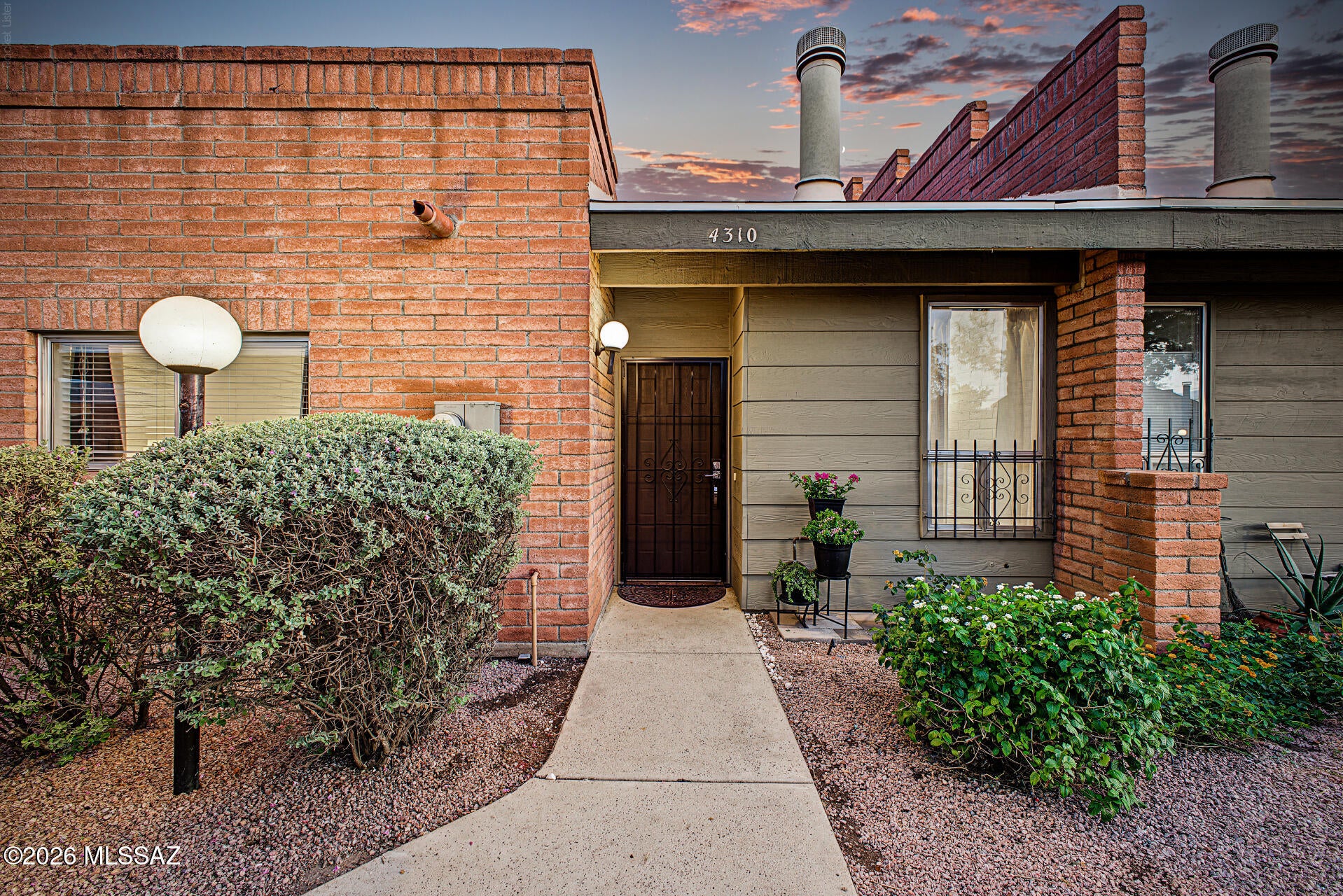 The search is finally over! Minutes from UofA, major hospitals & central Tucson, 85712 has to offer. This turn-key townhome is move-in ready & the furnishings can be included by separate agreement. Soaring vaulted ceilings, exposed brick feature walls, sleek concrete flooring & a fireplace create a stylish feel. The kitchen features granite counters, white shaker cabinets, recessed lighting, tile backsplash & stainless appliances, plus a full bath & walk-in closet. Upstairs, the loft with architectural beams makes an office or retreat. Enjoy natural desert open space, a fenced yard & room for a furry friend. The roof was replaced in 2023, the water heater in 2024 & the HVAC was recently deep-cleaned & inspected. Covered parking, HOA-covered water/sewer/trash & a community pool add ease.