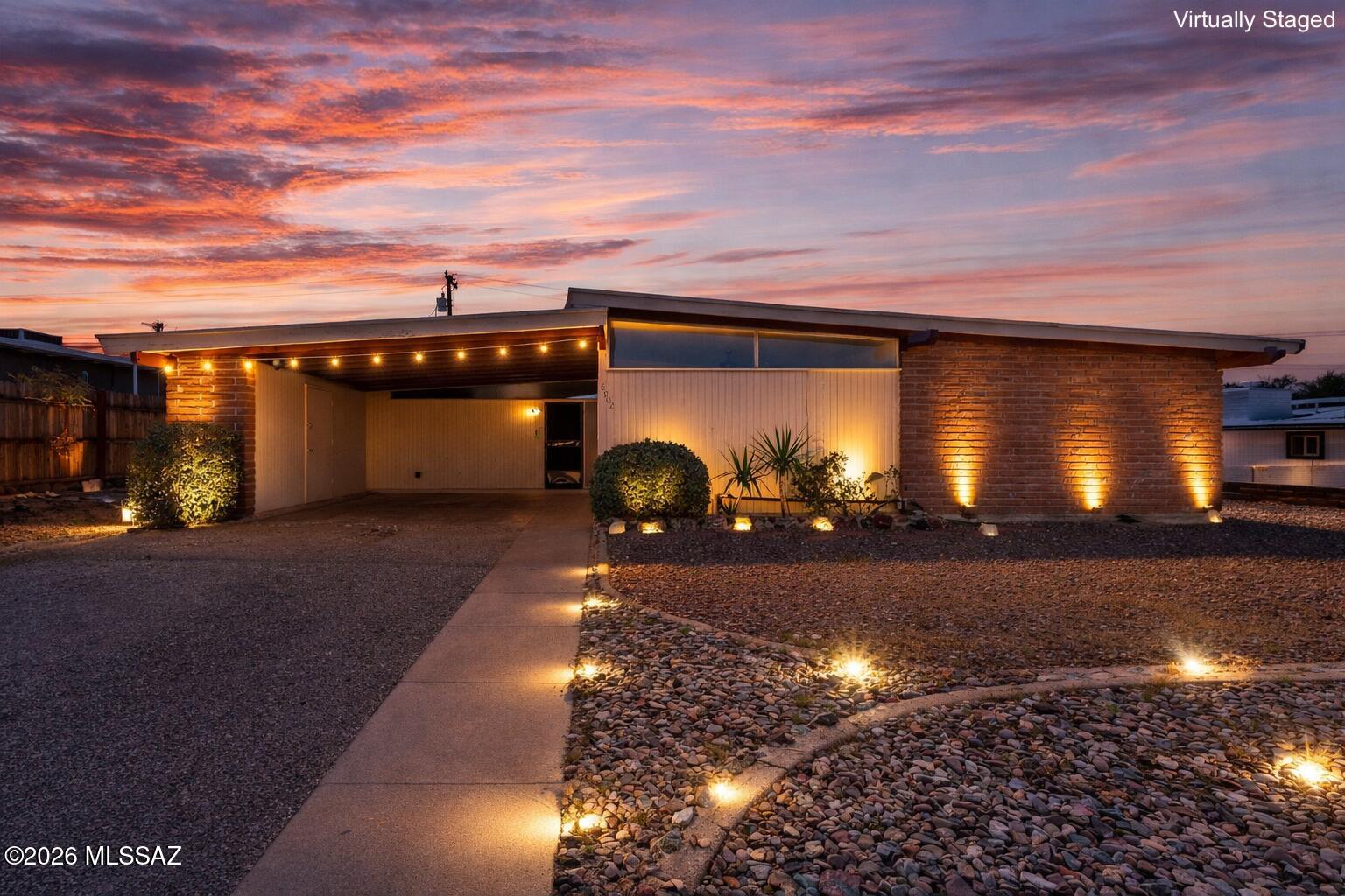PAID OFF SOLAR!!  Welcome to this beautifully updated 3 bed, 2 bath home with vaulted ceilings, fresh paint, and new luxury vinyl flooring and no carpet throughout. Enjoy a spacious living room, formal dining, and a family room with a cozy wood burning fireplace. The airy primary suite offers ample closet space and an en-suite bath with a premium vanity. The massive backyard is the real showstopper, featuring a covered patio, a huge detached workshop, and two additional storage sheds, all fully wired with electrical, making it ideal for hobbyists and DIY enthusiasts. There's also plenty of space for RV parking with hookups, adding even more versatility to the property. A truly rare find you don't want to miss!