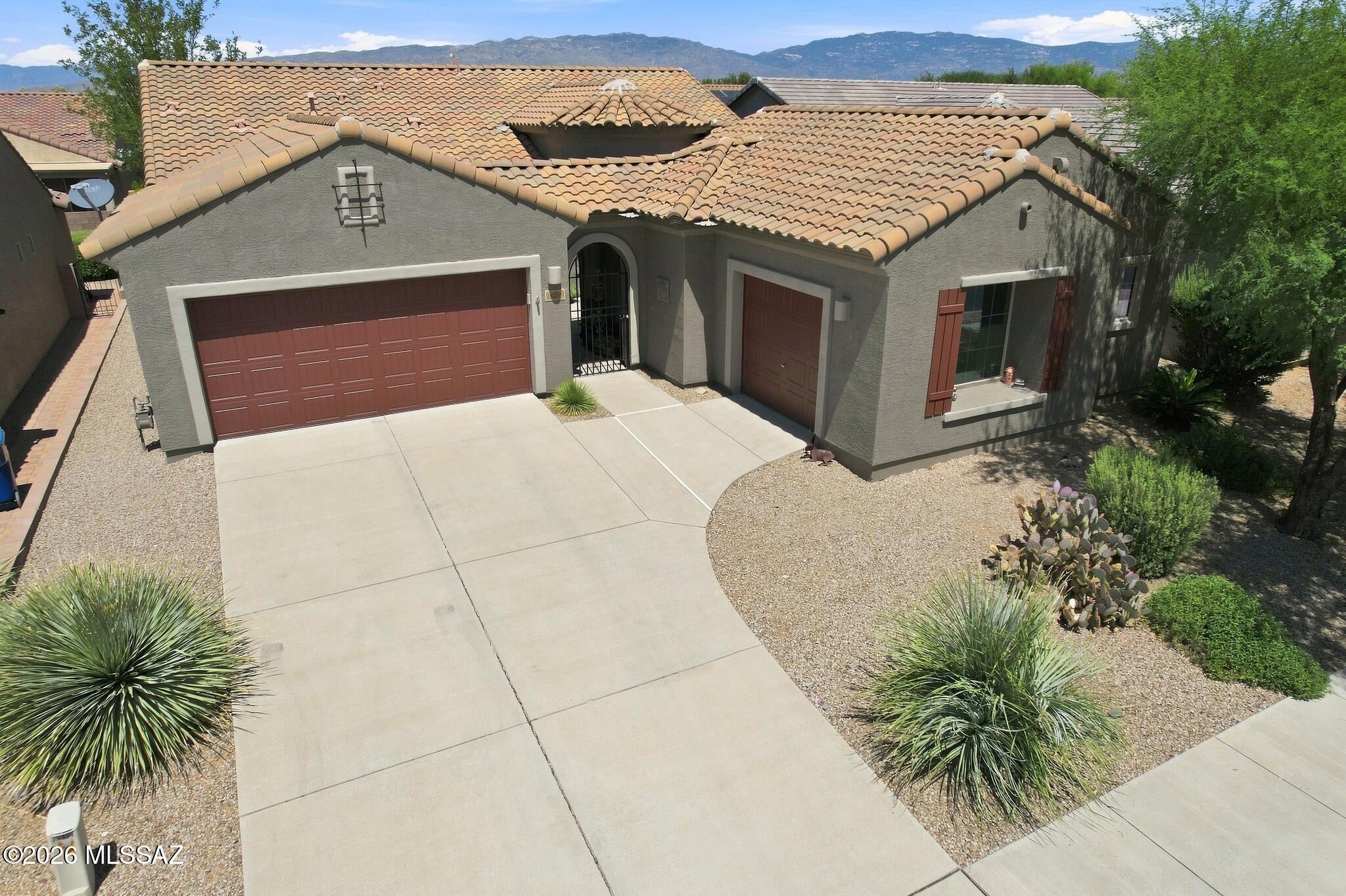 Spectacular 2BR+2Xtra Rooms/2.5BA w/oversized 3 car garage in 55+ Community of Del Webb at Rancho del Lago w/lovely courtyard entryway. 3rd bay of garage is heated & cooled w/inside access & currently used as a art studio but would make a fantastic workshop, craft or sewing room. Large beautiful marble entertainment center w/heated electric fireplace. Kitchen has large pantry, granite counters, tiled backsplash, & convenient island w/cutting board. Primary BR is very spacious & comes w/a large walk in beautiful shower. Office has built in book shelf & desk. Guest BR w/ensuite full bath. Cozy den is a nice secondary relaxing room w/courtyard view. Back patio area faces north w/lots of shade trees, privacy & soothing fountain. Close to all the great facilities here at wonderful Del Webb !!