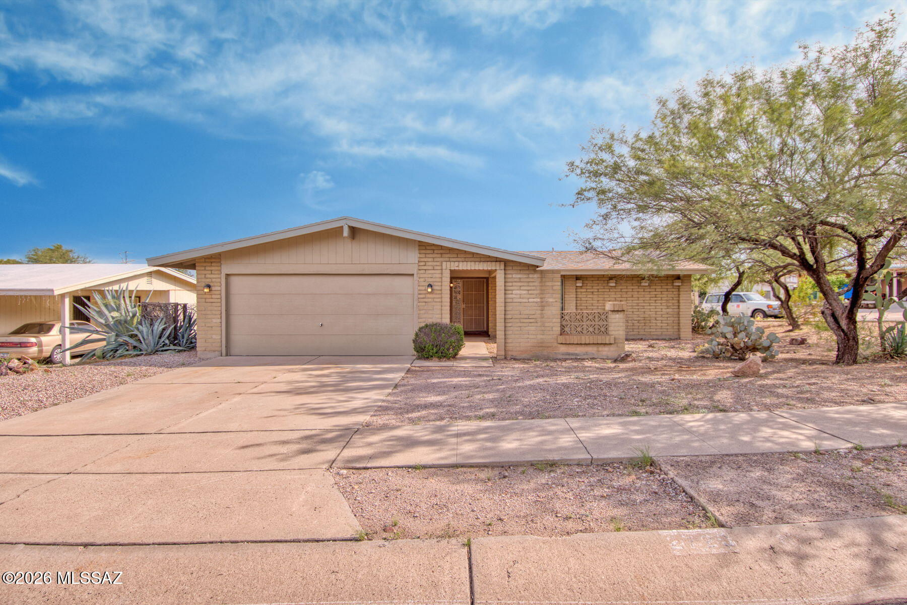 Rare opportunity in an established Tucson neighborhood where homes don't come available often! This well-cared-for 3BR/2BA home has had just two owners and shows true pride of ownership. Move-in ready with updated bathrooms, windows, tile and vinyl flooring, brand-new ceiling fans, and an updated kitchen featuring granite countertops, updated cabinetry and stainless steel appliances. Situated on a large corner lot with beautiful views of Enchanted Hills Peak and trail access just steps from your front door. The spacious, private backyard features mature trees and plenty of room to relax or entertain. A wonderful combination of location, views, updates and pride of ownership!