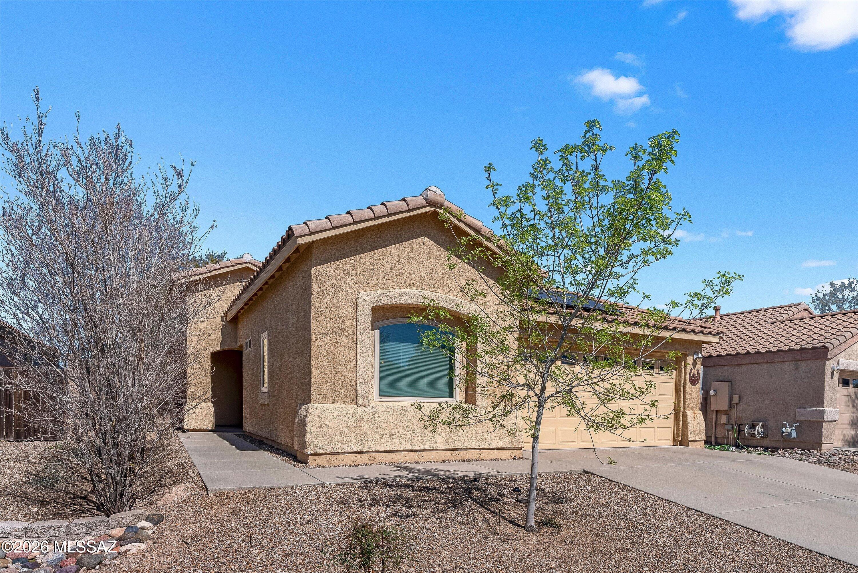 Located in the highly sought-after Vail School District and within the boundary for Mica Mountain High School, this meticulously maintained 3-bedroom, 2-bath home clearly shows pride of ownership. Featuring one of Lennar's most popular and spacious floor plans, the open-concept layout offers comfortable everyday living with vaulted ceilings throughout. This exceptionally cared for home is move-in ready. An added bonus is the solar system, helping reduce utility costs while supporting an electric vehicle -- a practical and valuable feature. Upgrades throughout the home that adds efficiency and comfort including surround sound. An opportunity to own in a desirable community with convenient access to parks, shopping, schools, and everyday amenities.