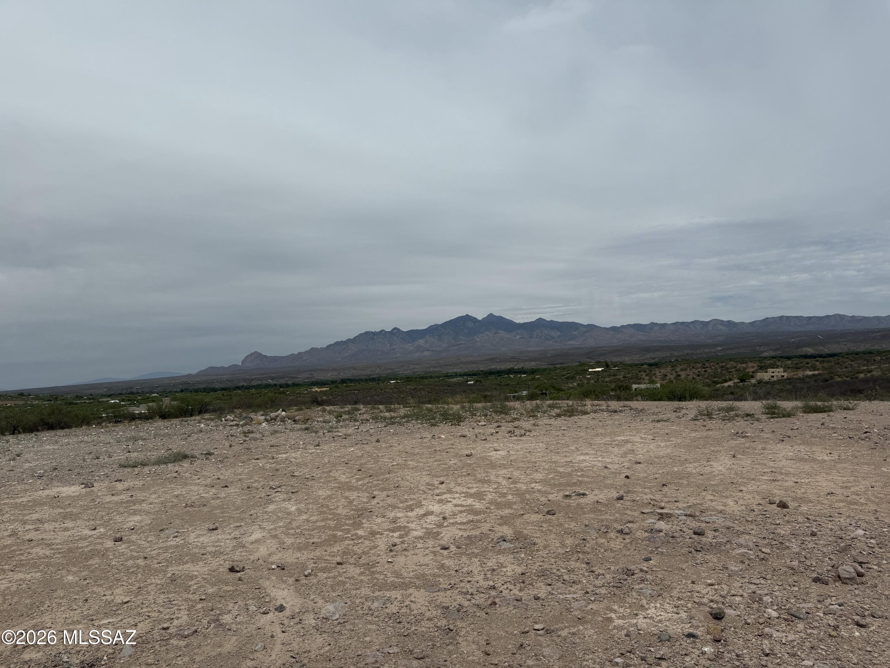 Enjoy the best of both worlds with this beautiful 4+ acre parcel offering the charm and privacy of country living while still enjoying the conveniences of a neighborhood setting. Take in sweeping views of the Tumacácori and Santa Rita Mountains along with the stunning Santa Cruz River Valley. The property features a shared well and storage tank already in place, plus phone and electric available to the lot -- making it ready for your dream home. A homesite pad has already been cleared, giving you a head start on building. Located just a short drive from Tubac, you'll have easy access to shopping, dining, golfing, hiking, and all the unique charm the area has to offer. The owner has a set of building plans available for the property!