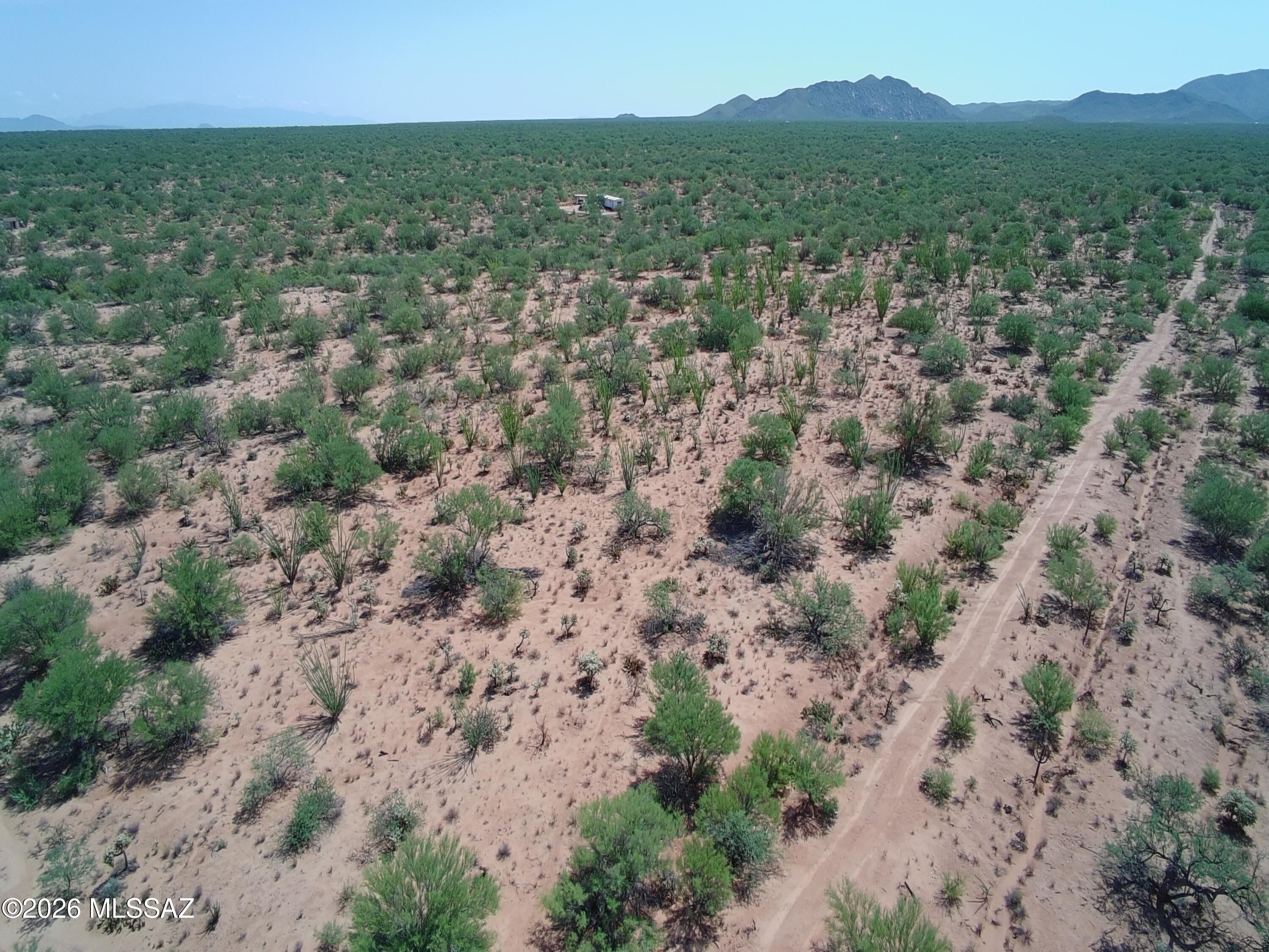 Positioned just moments from expansive Arizona State Land, this 1.06-acre parcel in Diamond Bell Ranch delivers permanent desert atmosphere and unobstructed views of two distinct mountain ranges. The flat terrain captures ideal North/South exposure, showcasing panoramic desert vistas, dramatic sunrises, and dark-sky sunsets framed by local wildlife. Free of HOA restrictions and situated outside FEMA flood zones, the lot is zoned Pima County CR-1--offering a clean slate for custom site-built designs or off-grid living options.