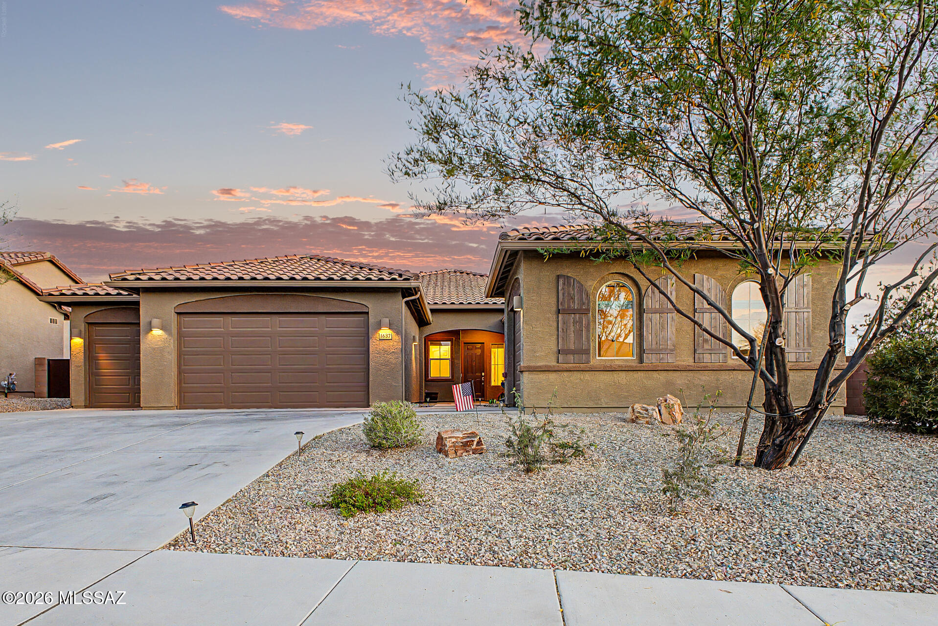 Beautiful 2,594 SF home Built in 2021 with attached casita which includes 1 Bed/1Bath, 1-car garage, kitchenette, great room & private patio-ideal for guests or multigenerational living. Main home offers 3 bedrooms/2 full baths, spacious primary suite with patio access, walk-in closet, double vanity & custom tiled shower. Open kitchen features double ovens, stainless appliances, walk-in pantry & abundant counter space, flowing into the great room with backyard views. Resort-style backyard w/ PebbleTec pool, spa & waterfall surrounded by mature landscaping, paver patios, irrigated garden beds & citrus trees. Owned solar, rain gutters with cistern rain barrel & added privacy with no neighbors to the west--plus beautiful sunset and Catalina Mountain views.