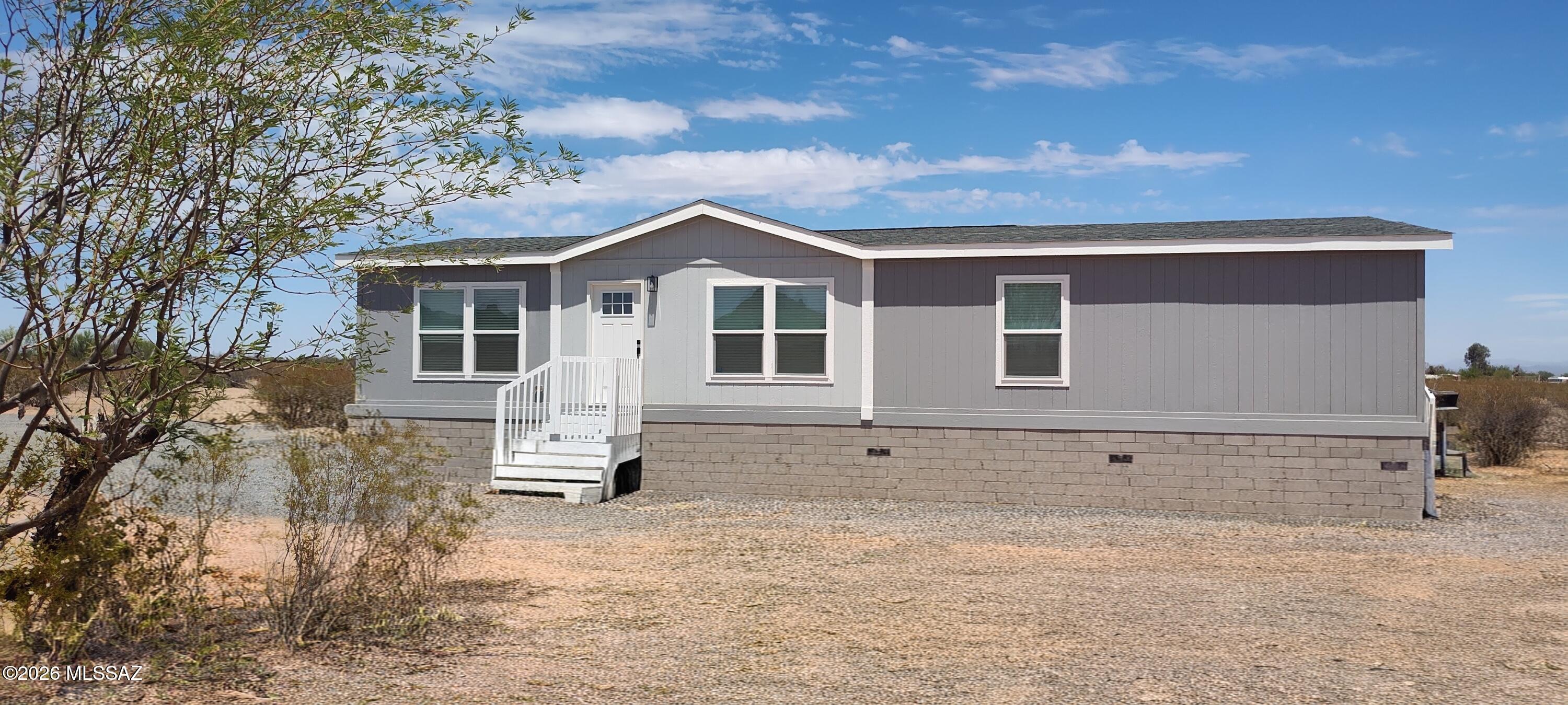 Private desert retreat in Avra Valley--where wide open skies, peaceful surroundings, and endless possibilities await. Situated on a 4.2-acre lot, this brand-new manufactured home offers an opportunity to own a slice of Arizona with room to truly live. Tucked away for ultimate privacy, this property is ideal for those seeking space, independence, and a break from the city life. Inside, enjoy a fresh, modern interior with the benefits of new construction--clean finishes, open living spaces, and spacious rooms for guests, or home office. Bring your >RVs, trailers, and toys. >Horses/animals >Gardening or homestead dreams >Visions of outbuildings and workshops. No HOA and little limits on your land use. This is the one for breathtaking sunsets, star-filled skies and hard to find quietness. Outside, the possibilities are where this property truly shines.

Bring your:
 RVs, trailers, and toys
 Horses or animals (verify zoning)
 Gardening or homesteading dreams
 Vision for outbuildings, workshops, or expansion

With over 4 acres, there's no HOA and no limits to how you use your land--create your own desert oasis, weekend escape, or full-time retreat.

Enjoy breathtaking Arizona sunsets, star-filled skies, and the kind of quiet that's hard to find anymore--all while still within reach of nearby amenities.

If you've been searching for space, privacy, and freedom to live life on your terms, this is the one.