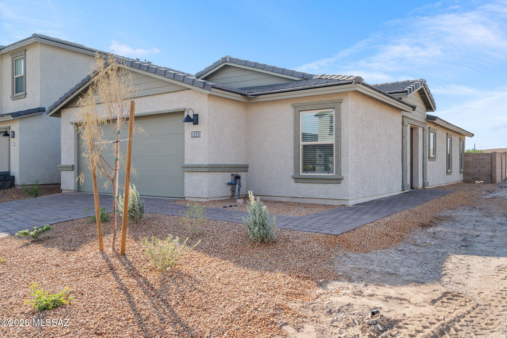 Be the first to live in this brand-new 3 bed, 2 bath home in the gated community of Gladden Farms in Marana! The kitchen has quartz countertops, and ceiling fans in every bedroom and the living room keep things comfortable year-round. The primary bath has a walk-in shower, and the second bath has a shower/tub combo. The rocked backyard is low-maintenance, so you'll have more time to enjoy Arizona. Residents can also use the community clubhouse, which has a fitness center, a pool and more! It's just minutes from the Marana Water Park, the new Fry's, shopping and dining, with quick access to I-10. This home is brand new and move-in ready, so it won't last long. Schedule your showing today!