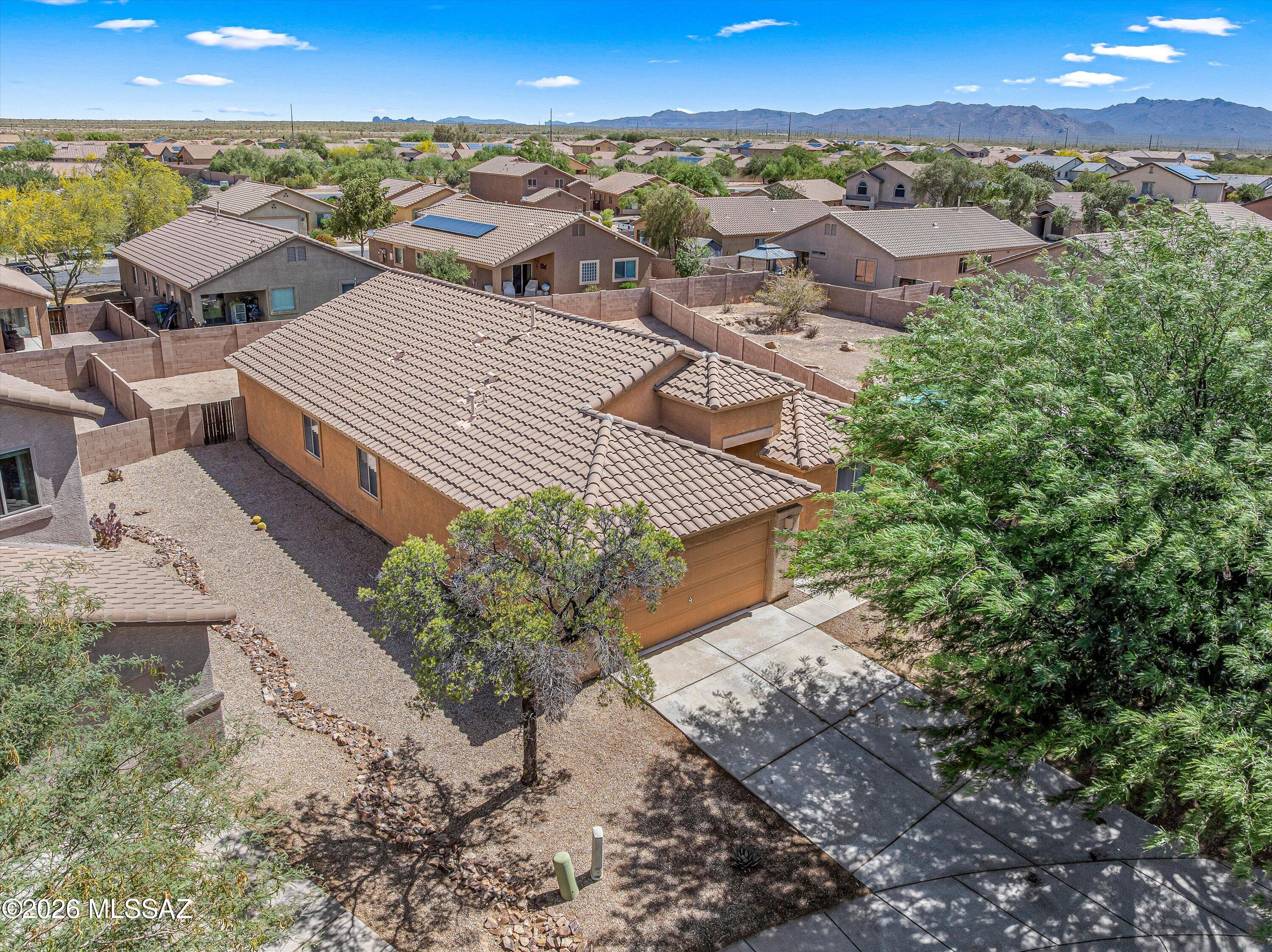 Beautiful San Lucas home on oversized cul-de-sac lot! Come enjoy all Marana has to offer: New Rec Center with splash pads & slides, tons of new shopping and restaurants emerging. Home features formal separate living room and dining room with soaring vaulted ceilings. Open kitchen with large center island overlooks family room and breakfast area. Separate pantry closet, lots of counter & cabinet space and all appliances included.  Oversized ceramic tile, lots of natural light, ceiling fans, epoxy coated garage floors, and more. Spacious Primary bedroom has large walk-in closet, dual sink vanity, and relaxing soaking tub. Huge backyard and side yard with plenty of room for pool, gardens or what ever you can dream! 2 neighborhood parks with grass areas, play equipment, and ramadas.