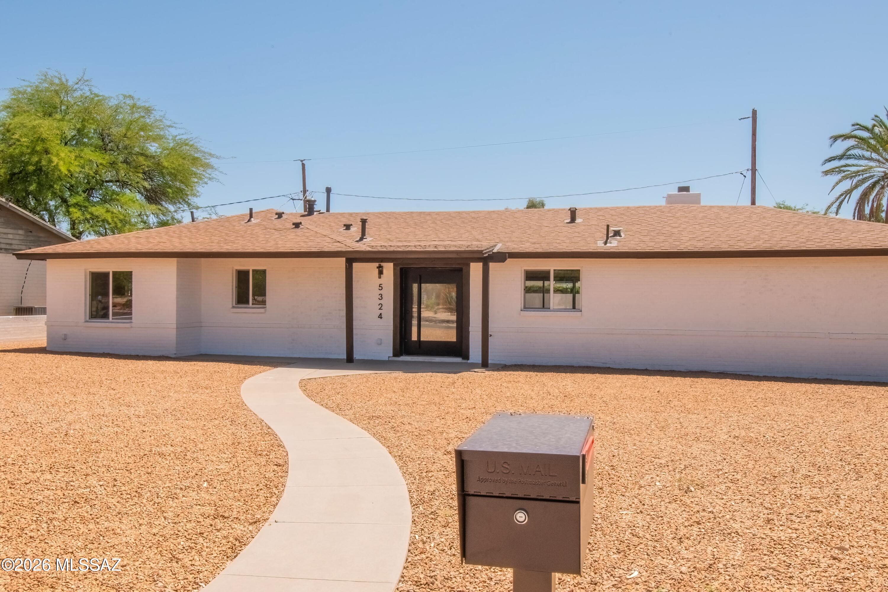 Exquisitely updated & renovated thruout 4BD/3BA on large corner lot in conveniently located midtown. Striking contemporary style & sophistication hilights huge open floor plan, tile floors in all living areas! Brand new Stainless Steel appliances, Kitchen island w/smooth top range & Breakfast Bar. BDRMS w/ez care carpet. Primary Bath On Suite w/double vanity & dual shower heads, walk in closet. Baths w/LED lit mirrors.  Shower surrounds w/tile to ceiling. Laundry rm w/utility sink. New dual pane windows, new doors, Huge backyard w/oversized gate to allow vehicle entry off alley. Extended covered patio, Decorative rock front & back. Parking pad.  New sewer line & new water supply line from meter to interior. New insulation. North/South orientation. Across from Highland Vista's park & pool.
