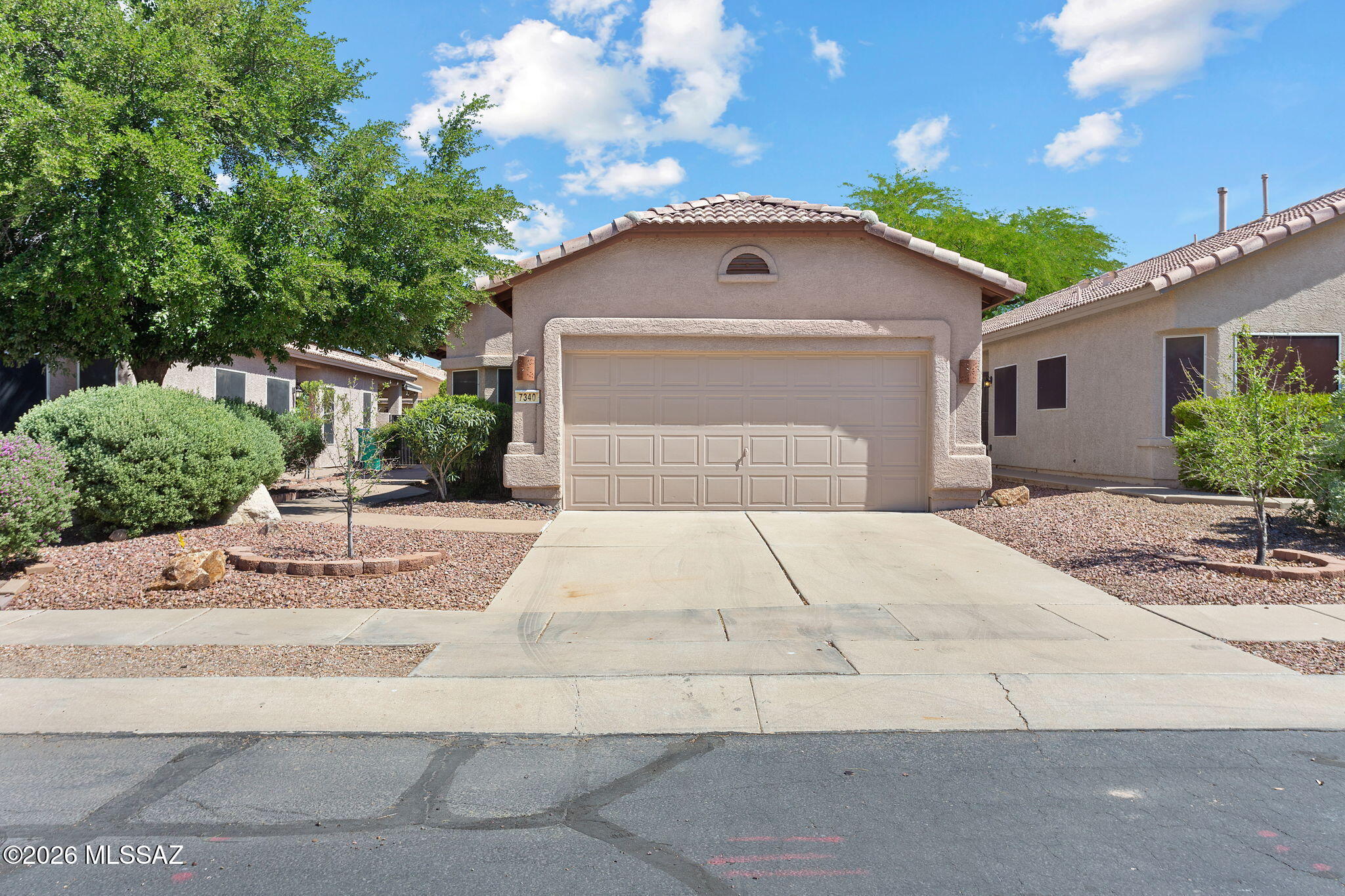 Thoughtful custom finishes add character and style in this beautiful 2 bed, 2 bath home in Continental Ranch. Enjoy diagonal-laid tile throughout the entire home- no carpet! Granite countertops in kitchen and baths, refinished cabinets, and updated hardware/fixtures. Retreat to the serene backyard with large covered patio, mostly hardscaped for low maintenance while offering the perfect amount of mature greenery. The charm of this home must be felt in person- schedule a tour today!