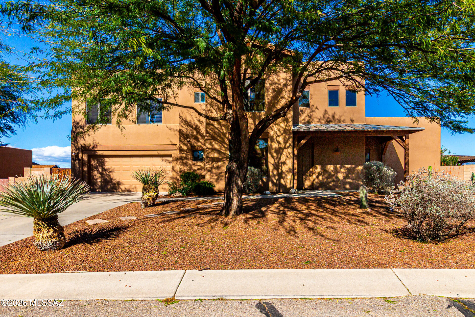 Located in the desirable Rincon Trails community in Vail, this two-story home sits on over 1/4 acre with no rear neighbors and stunning mountain views. The primary suite is thoughtfully positioned downstairs for added privacy, while an upstairs loft offers flexible space for a second living area, office, or playroom.

The backyard is built for Arizona living with a sparkling pool and expansive turf area, perfect for entertaining or relaxing. One upstairs bedroom features custom built-in queen bunk beds, and a main-level bonus room is currently set up as a gym. Fully paid-off solar provides energy efficiency and long-term savings.

Enjoy access to the neighborhood park with a playground, basketball court, and volleyball court, all within the highly sought-after Vail School District.
