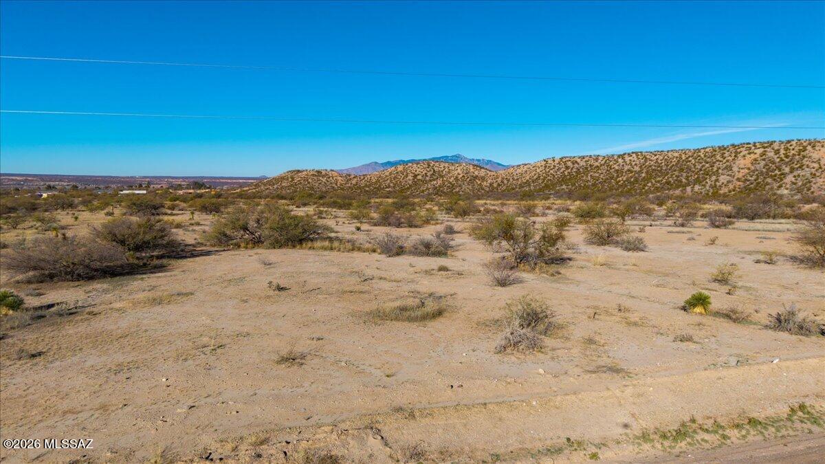 Spectacular country acreage just 5 minutes to I-10 and Benson shopping.  Mostly level but slowly rising to a hill top ridge for sweeping view of the City Lights, surrounding mountain ranges, sunrises and sunsets.  Build you mini-ranch estate or split off a portion and keep your home site!   Pomerene Water just west on Alvie Lee and can serve the property if you wish or drill a well !  Electric available at the road.   Seller will consider and owner carry for not more than five years.