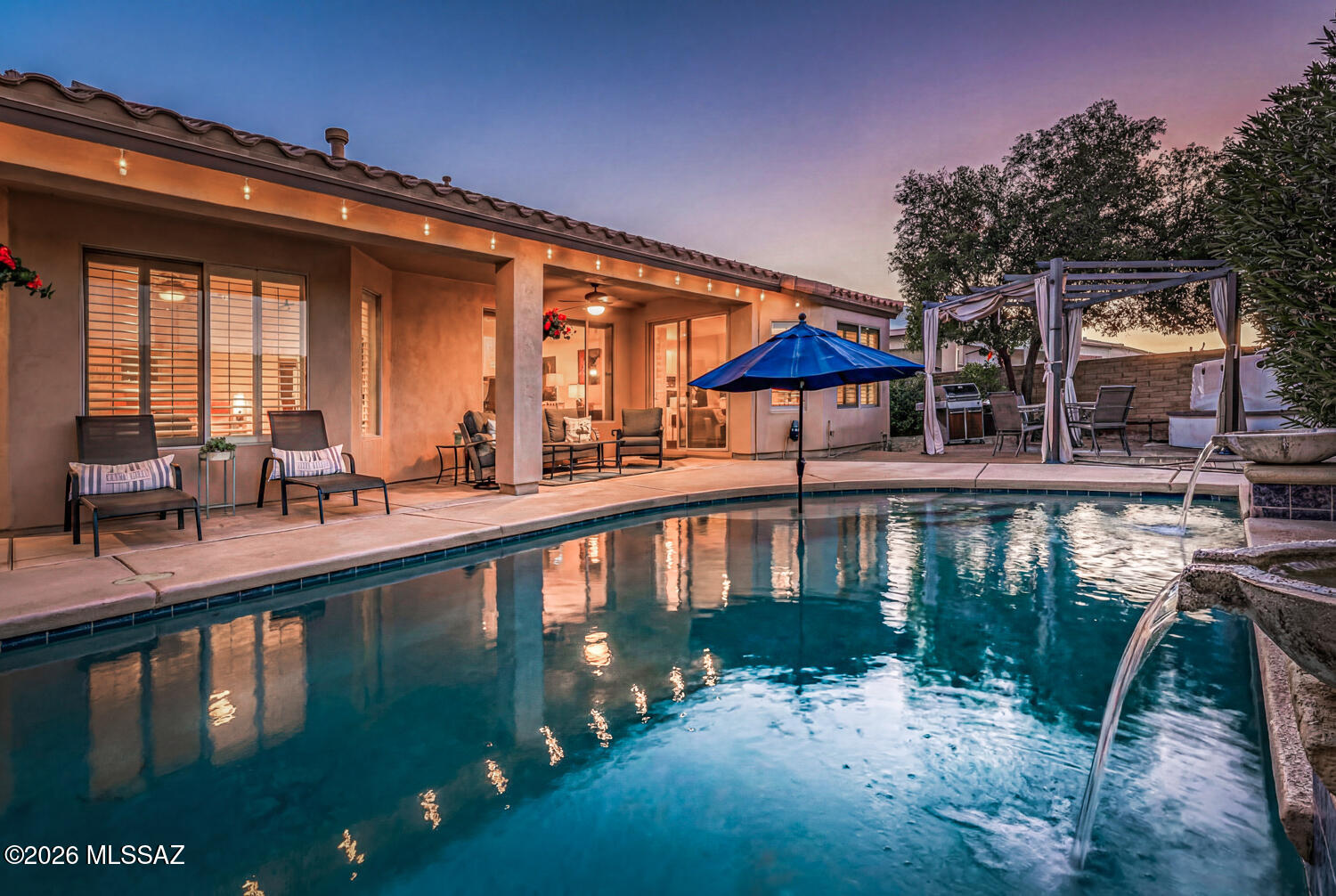 *NEW PRICE* FRESH OPPORTUNITY to Embrace this serene oasis, where every day feels like a vacation. This exquisite residence is perfectly nestled within an active retirement community that embodies resort-style living. Your personal retreat features two well-appointed bedrooms and two full bathrooms, including a spacious main suite with a private en-suite and a generous closet. The second bedroom is ingeniously designed with a split floor plan, offering guests privacy. The open living area, complete with a Cozy Fireplace and charming vestibule entry, invites you to relax and entertain in style. The heart of the home is the kitchen, a chef's delight, with a dining bar, generous cabinet space, a spacious pantry, granite countertops/all the appliances and open to the warm Great Room. Step outside to your covered patio and private heated, sparkling pool, where you can bask in the Arizona sunshine or host a BBQ in your backyard. The maintained landscape offers a serene backdrop for your outdoor leisure. With a two-car garage, the home features a whole-house filter system. Once you enter through the guard gate, you'll discover a world of community amenities. From the radiant community pools and spas to the meticulously maintained golf course, tennis, and pickleball courts, your social and fitness needs are just a stone's throw away. The new Canyon Club, the restaurant, and racquetball facilities are the cherries on top of this delightful living experience. Make this your retreat.