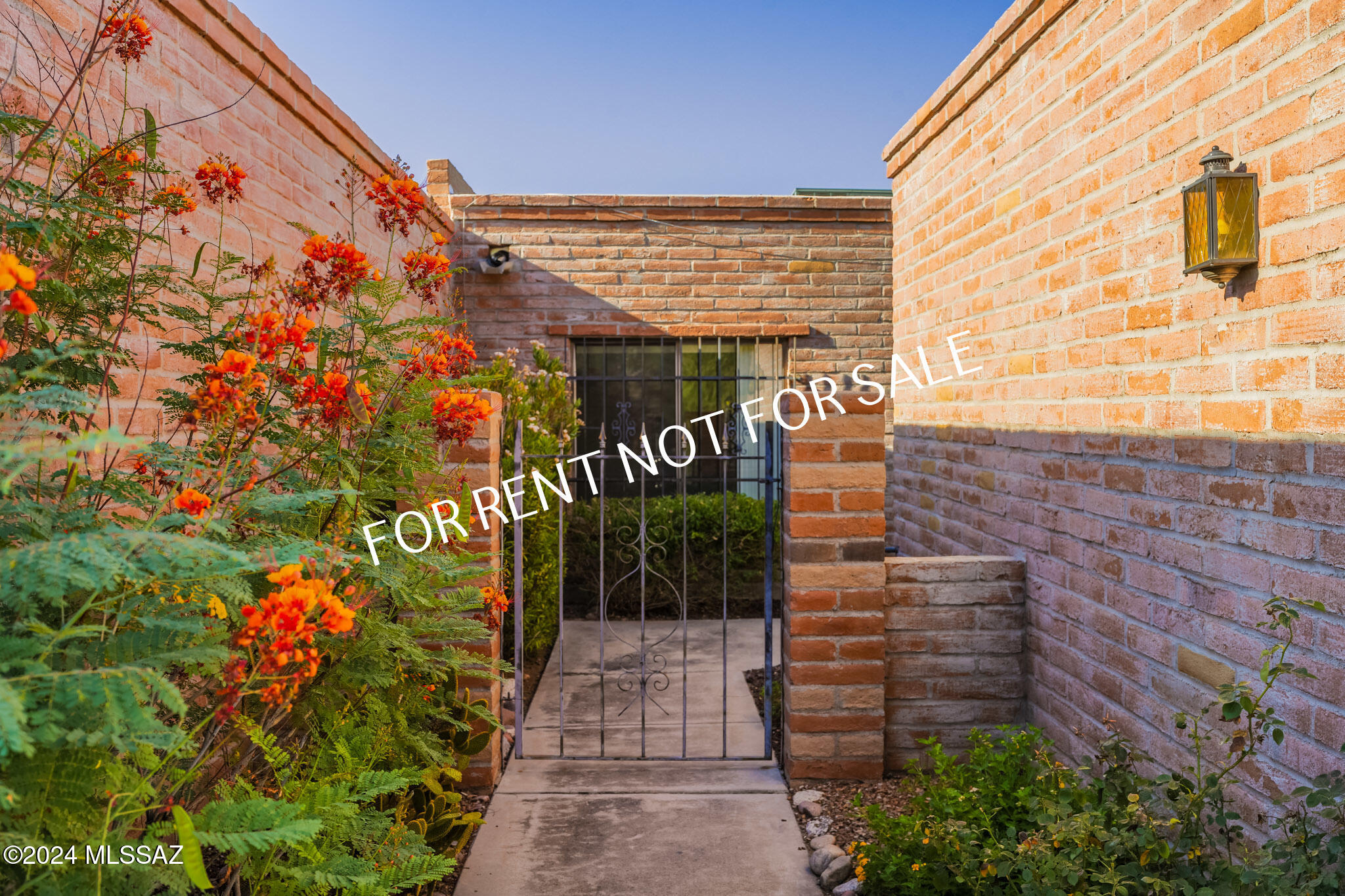 Built 1980- Tucked away on a quiet, hidden street in the desirable Fairfield Community, this burnt adobe townhome features 2 BED 2 BATH - 1364 sq. ft., court yard entry, carpet and ceramic, Living and Dining area with cozy fireplace, slider doors from living room and master bedroom to the back patio with views. Large kitchen with eat-in area. Appliances included: SS New Refrigerator, Stove/Oven with Built-in Microwave combo unit, Dishwasher, Laundry room with Washer/Dryer, oversized garage. Community Pool. Pets are subject to approval - Dogs only. **Please visit our website for SECURITY DEPOSIT, PET RENT, & NON-REFUNDABLE PET FEE INFORMATION.