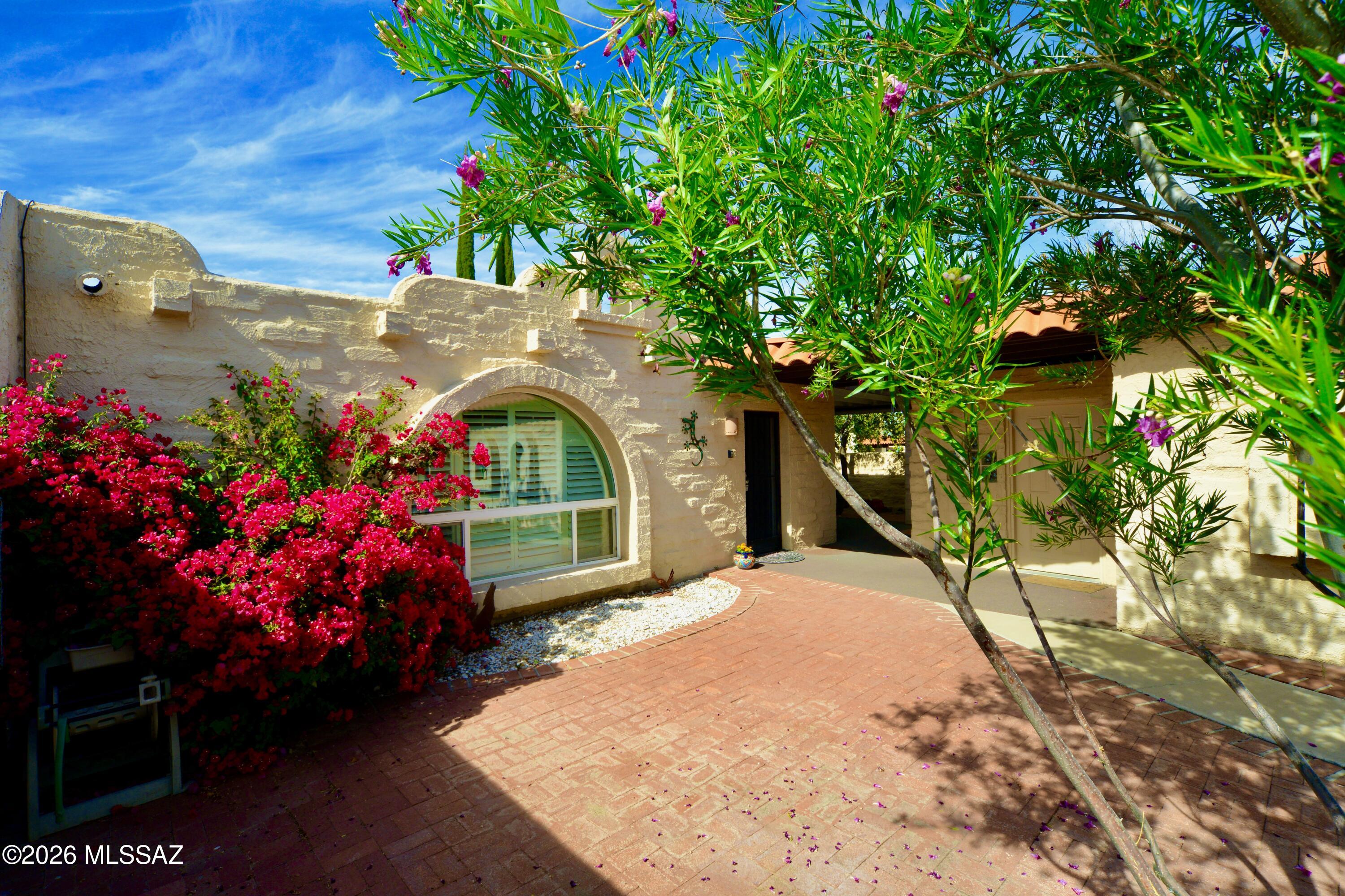 MOVE-IN READY! Light, bright, & beautifully updated, this desirable Esperanza Estates home offers the privacy & comfort you've been searching for. A charming front courtyard welcomes you into this inviting retreat in one of Green Valley's popular 55+ communities. Inside, you'll find tile flooring throughout, new windows, and an updated kitchen featuring sleek cabinetry, stainless steel appliances, and granite countertops. The spacious 3-bed layout provides flexibility for guests, hobbies, or a home office. Enjoy Arizona living on the wraparound patio, where afternoon shade & added privacy create the perfect setting for relaxing or entertaining. Thoughtfully updated and ready to enjoy, this home lets you start living the Green Valley lifestyle from day one!