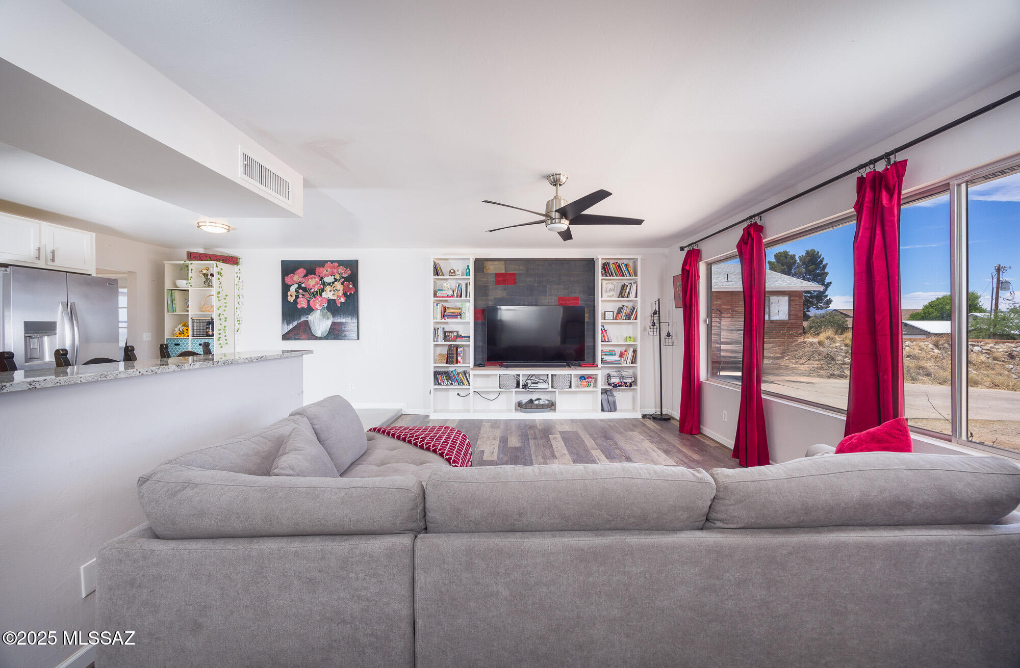 Welcome to your dream home! This beautifully remodeled 4-bedroom, 2-bath residence offers an open-concept layout perfect for modern living. The spacious family room features a stunning fireplace, creating a warm and inviting atmosphere. Enjoy breathtaking views of the surrounding mountains from the comfort of your own home. The kitchen and bathrooms are adorned with granite countertops throughout, adding a touch of elegance to every space. A detached garage includes a bonus room, offering flexible space for an office, studio, or guest area. Conveniently located close to shopping, schools, and medical facilities, this move-in-ready home is waiting for you!
