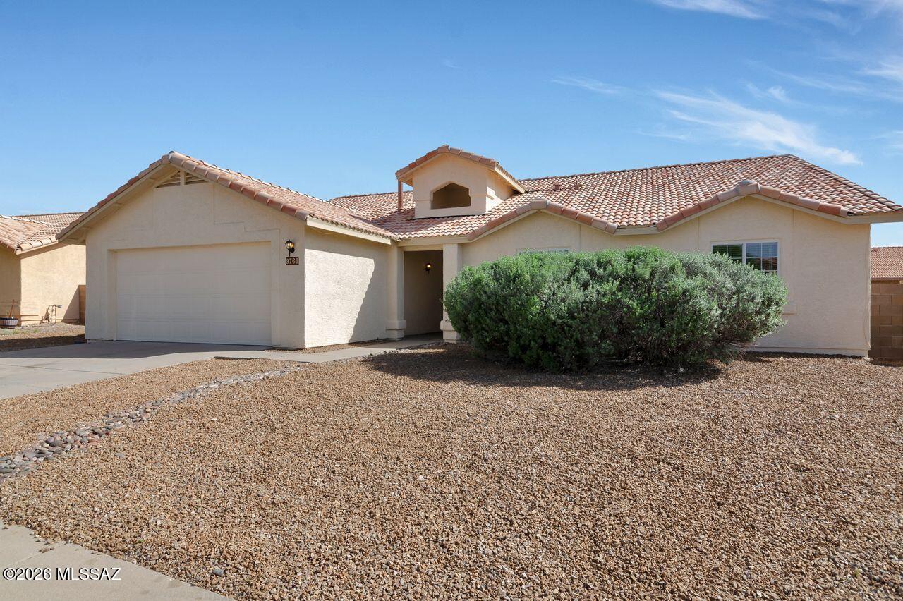 Located in Rita Ranch near Purple Heart Park and shopping, this well-maintained home has been fully reconditioned for a new buyer. Features include ceiling fans in all four bedrooms, a newer roof, a bay window in the dining area, and a cozy gas wood burning fireplace in the living room. The home offers fresh interior and exterior paint, new appliances, new carpet, and refinished kitchen cabinets. Enjoy a covered patio overlooking a spacious yard with drip irrigation, plus a 2-car garage. Fully cleaned and truly move-in ready, this home offers comfort and convenience in a desirable location.