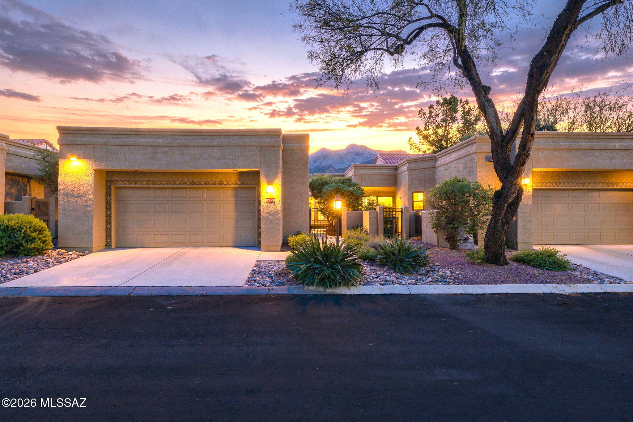 Experience refined desert living in this beautifully appointed Golf Villa located within the prestigious gated community of Ventana Canyon. Perfectly positioned along the golf course, 6969 E Nuthatch Trail offers an exceptional combination of privacy, dramatic Catalina Mountain scenery, golf course vistas and the effortless lock-and-leave lifestyle that makes Ventana Canyon one of Tucson's most desirable addresses. This single-level, approximately 1,397-square-foot residence features two bedrooms, two bathrooms and a two-car garage, with a light-filled interior designed for both comfortable everyday living and elegant entertaining. Vaulted ceilings enhance the sense of space, while the great room is anchored by a striking stacked-stone fireplace and opens naturally to the home's inviting outdoor living areas. Travertine flooring lends timeless Southwestern sophistication throughout the main living spaces.

The remodeled kitchen is both stylish and functional, featuring quartz countertops, stainless steel appliances, updated cabinetry, a center island and breakfast bar. Both bathrooms have also been thoughtfully updated, while the spacious primary suite provides a tranquil retreat with generous closet space and an updated bath.

Step outside to a private patio where beautiful golf course, mountain and sunset views create an extraordinary backdrop for morning coffee, evening cocktails or dining beneath the Arizona sky. Low-maintenance landscaping further enhances the ease of ownership.

Residents of the Ventana Canyon Golf Villas enjoy access to a heated community pool and spa, all within the spectacular natural setting of Ventana Canyon. The home is also ideally located near the Ventana Canyon Club, world-class golf, Sabino Canyon Recreation Area, hiking and outdoor recreation, as well as some of the Catalina Foothills' finest dining and shopping.

Located within the highly regarded Catalina Foothills School District, this exceptional Golf Villa presents a rare opportunity for a primary residence, seasonal retreat or sophisticated Tucson getaway in one of the Foothills' most sought-after gated communities.