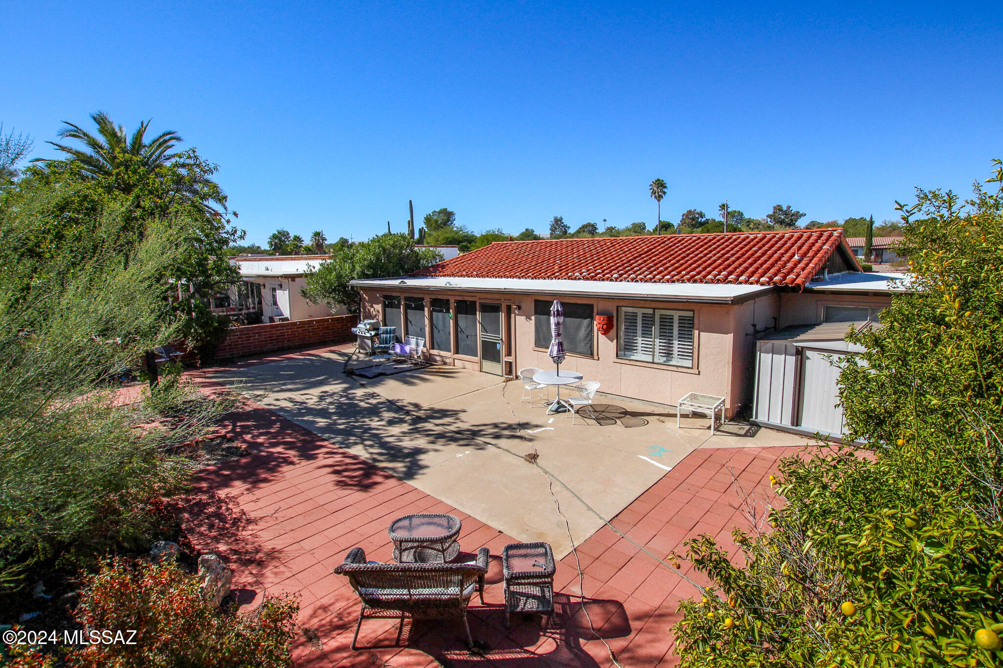 Move-in ready 3-bedroom, 2-bath home in a sought-after 55+ community near a scenic golf course in Green Valley, AZ. This property features a workshop, mature fruit trees, a bright Arizona room, and a private fenced yard for relaxation. Furniture is available, making your transition seamless. Ideally located near shopping and recreation, you'll enjoy access to all the amenities of Green Valley Recreation, including pools, fitness centers, and a variety of classes. A perfect blend of comfort, convenience, and an active lifestyle awaits!