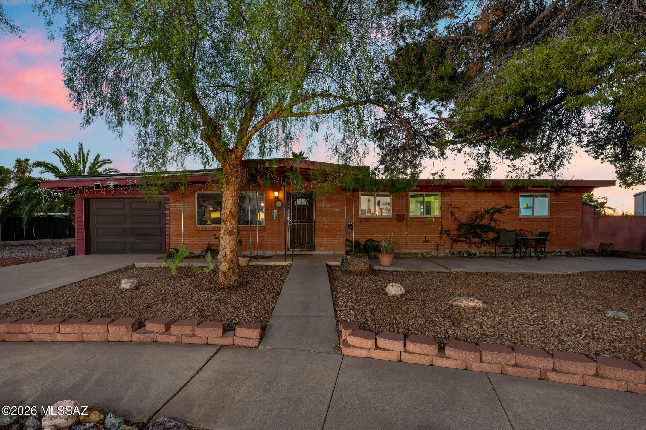 This single-story Tucson home offers 4 bedrooms, 2 bathrooms, and a comfortable living space! Featuring ceramic tile flooring throughout, the interior provides a clean, low-maintenance foundation ready for your personal touch. The kitchen includes white appliances and an electric range, while the primary suite offers a simple layout with a closet featuring bi-fold doors.

Step outside to enjoy a covered patio complete with a hot tub, perfect for relaxing or entertaining. Both front and backyard feature low-maintenance landscaping, and the property is fully enclosed with a block wall for added privacy. With no HOA and ample space for RV parking, this home offers flexibility and freedom that's hard to find. Your next chapter starts here!