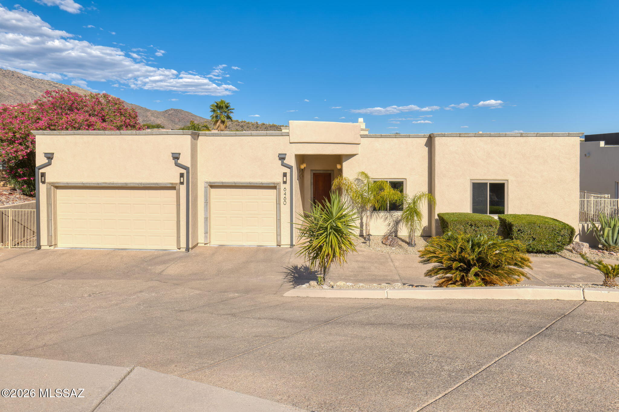 Nestled in the prestigious Regal Manor Estates of the Catalina Foothills, this refined 4-bedroom, 5-bathroom single-level residence offers approximately 3,500 sq ft of gracious living with breathtaking Catalina Mountain views. The interior is bathed in natural light with soaring ceilings, graceful arched passageways, and dramatic walls of glass that frame the outdoors. Elegant tile flooring flows seamlessly throughout with no carpet. The gourmet kitchen features a large granite island with seating for six, rich dark wood cabinetry with glass-front uppers, mosaic tile backsplash, and a huge walk-in pantry. Every bedroom enjoys its own private ensuite bath. Outside, a resort-style backyard oasis unfolds with a free-form heated pool and spa, expansive flagstone patios, lush artificial turf... and mature desert landscaping. A built-in barbecue and oversized covered patio complete the ideal setting for year-round entertaining. Recent upgrades include a new roof (2026), fresh exterior paint (2026), new irrigation system (2021), and many more thoughtful improvements. Located minutes from Sabino Canyon Recreation Area, La Encantada, fine dining, golf, and hiking, this distinguished home offers the ultimate Catalina Foothills lifestyle. SEE UPGRADE SHEET & WATCH VIDEO!!