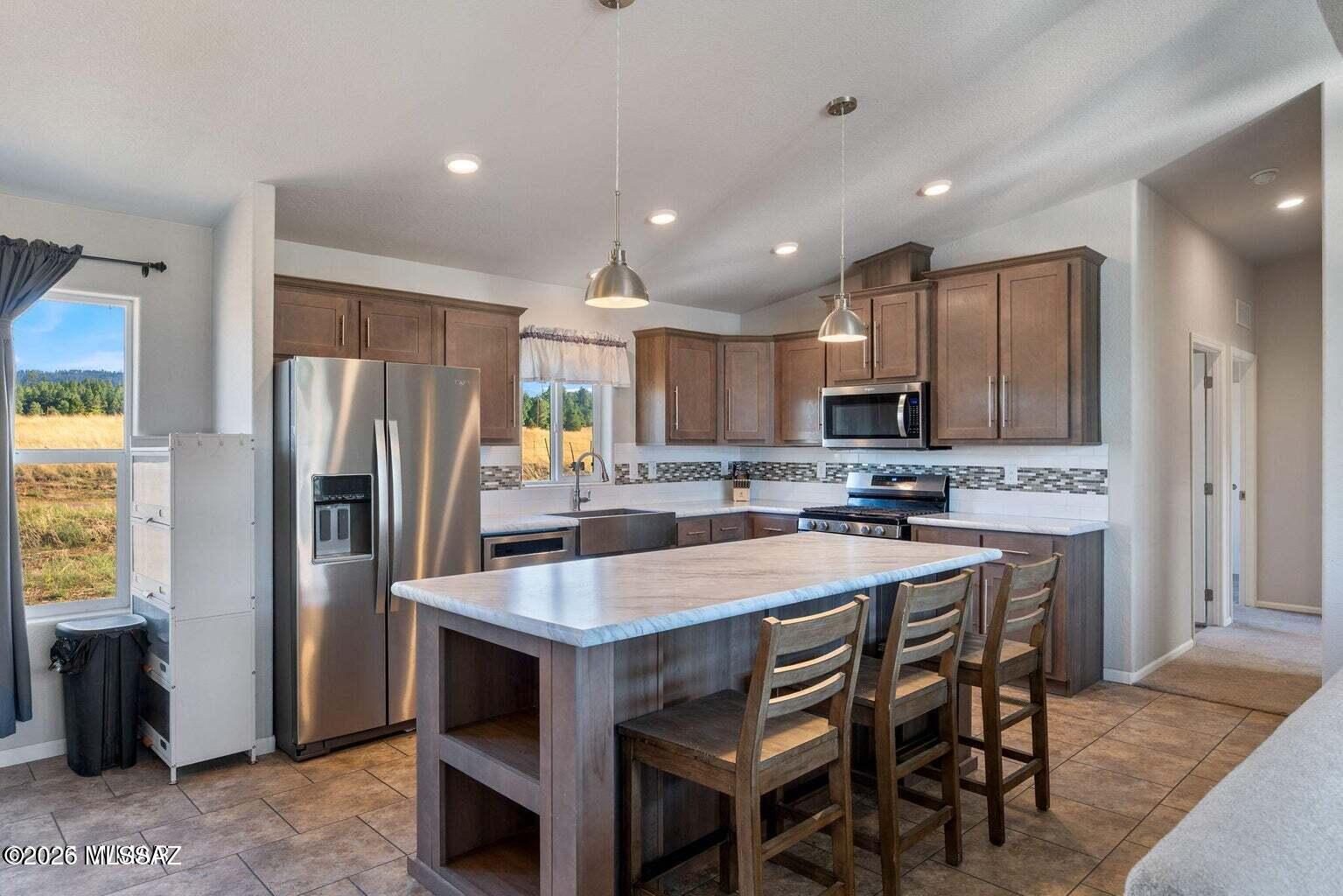 Modern Mountain Retreat with River Views, Greenhouse--with NO HOA!!! Welcome to your serene escape along the San Francisco River--this 2021 Champion AF2856E manufactured home offers 1,493 sq ft of well-designed living space, featuring 3 bedrooms and 2 full bathrooms. This home boasts 2x6 construction for superior snow load and wind resistance, as well as enhanced insulation for optimal winter comfort Inside, you'll find an inviting open-concept floor plan. The kitchen is a true centerpiece, offering a large farm-style sink, an expansive island perfect for entertaining, and seamless flow into the living room. The spacious primary suite includes a generous walk-in closet and a luxurious bathroom with a garden tub surrounded by windows ideal for relaxing while soaking in the view.

Oversized windows along the back of the home frame breathtaking views of the forest and San Francisco River, where elk often gather bringing the natural world right to your doorstep.

Outdoors, a fully equipped 500+ sq ft greenhouse features raised garden beds, a pond, heat-sensitive auto-opening windows, a solar fan, and enchanting lighting powered by a 2000Wh EcoFlow battery offering a peaceful, green space year-round, even in winter.
The 1.36-acre property is thoughtfully designed for future expansion or multigenerational living. Utilities are upgraded with 3-phase electric and a large-capacity sewer vault to accommodate a second cabin. A conditional use permit allows for a personal-use second dwelling (not for rental). An RV pad is also in place with full hookups electric, water, sewer, and gas perfect for guests or family. The 2003 Peterson XL 5th Wheel (in excellent condition) is available to purchase separately.

Additional highlights include:

A private well (100 ft deep, 20 ft to water, tested and functional)
An EcoFlow backup power system for seamless outage coverage ready for full solar integration with the included four 400 watt solar panels.
Starlink internet installed faster than many city providers
Nest security cameras at both entry doors and inside the greenhouse
Exterior 50-amp plug for EV charging, plus a 30-amp RV hookup
Dog run and raised deck with panoramic views overlooking Luna Lake ideal for enjoying morning coffee or watching the sunrise
This one-of-a-kind mountain retreat combines modern amenities, energy-conscious features, and peaceful natural surroundings in a setting perfect for year-round living or extended stays. Don't miss this rare opportunity to own a property that truly has it all.
