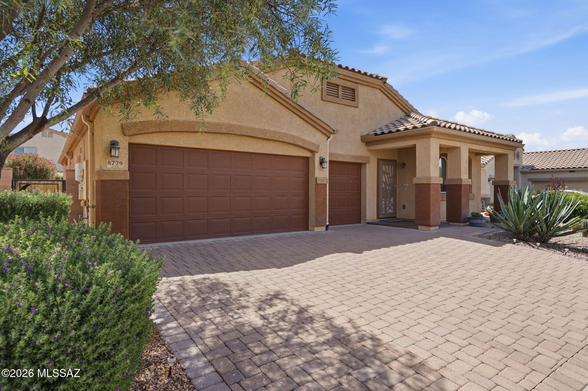 This meticulously maintained open concept home in Saguaro Bloom offers the ideal blend of comfort and outdoor enjoyment. Step outside to a generous back patio that provides plenty of room for dining, lounging, or hosting gatherings. The backyard is a true garden setting with vibrant flowers, lush bushes, and established trees that create a tranquil and private atmosphere.