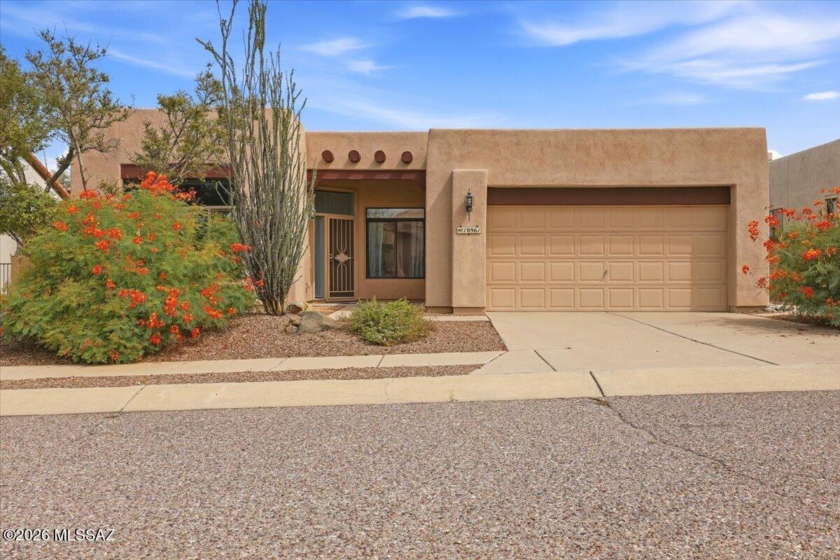 Perched on a premium, nearly half-acre cul-de-sac lot in the coveted Silverado Hills community, this bright and immaculate 3-bedroom plus den residence captures the true essence of Arizona living. From the moment you walk in, a wall of windows draws your eyes to the dramatic, unobstructed peaks of the Catalina and Rincon Mountains. The heart of the home is an open kitchen boasting double ovens, a large island, and endless storage. Retreat to the expansive primary suite, complete with its own scenic views and private patio access. Outside, the vast backyard features a mature grapefruit tree, covered patio, gate to the desert area and VIEWS.