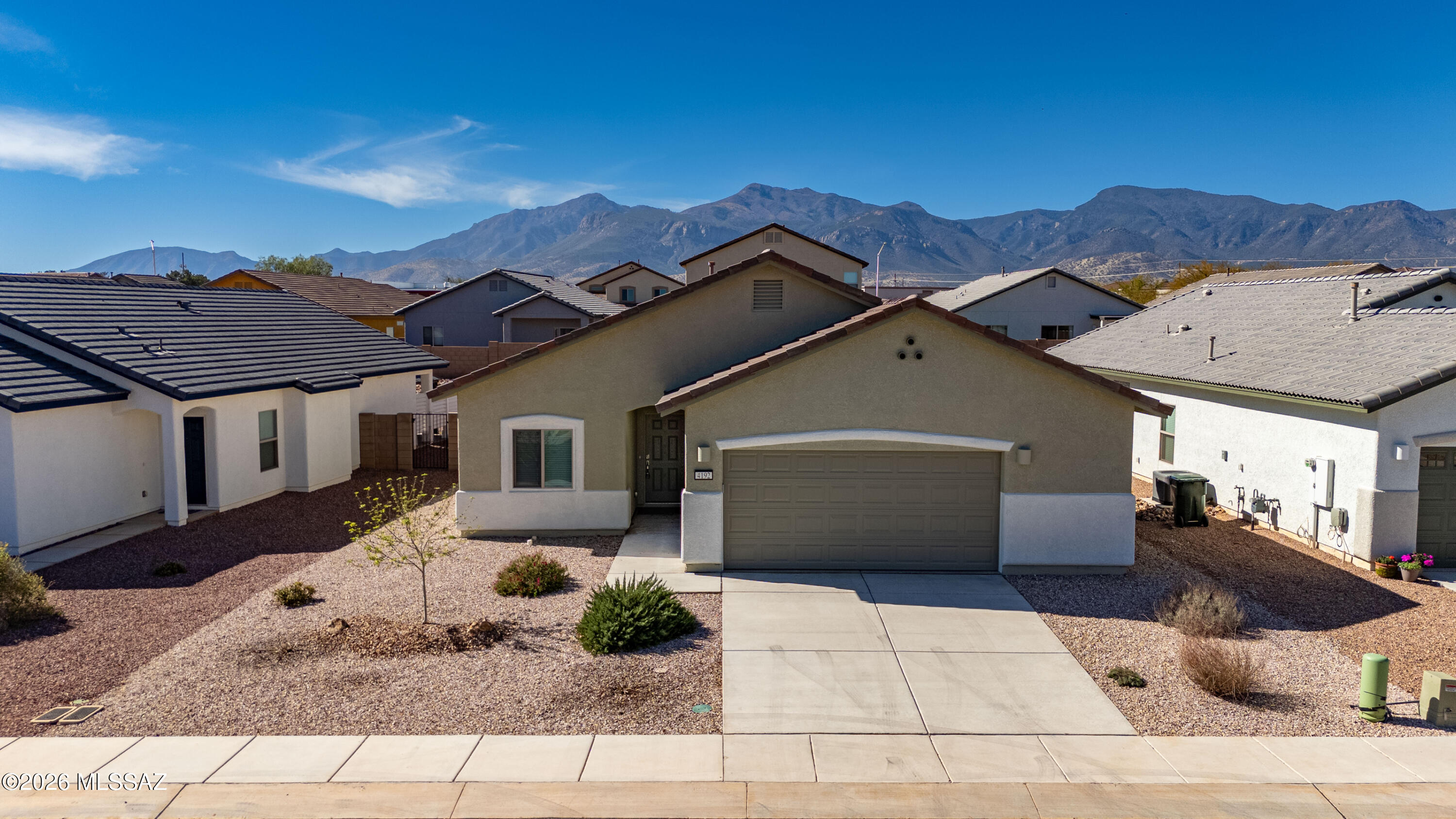 A like-new home that blends comfort, style, and convenience, this property features a spacious 2.5-car garage w/abundant storage, an EV charging outlet, and plumbing for a soft-water loop. Inside, the home feels bright and inviting with beautiful tile flooring, carpet in two bedrooms, granite countertops, and a custom-tiled primary shower. Bay windows in both dining area and primary bdrm add charm and natural light, while a large front bedroom/den/office with double doors and tile flooring offers flexible living space. Faux wood blinds on all windows! Essential appliances--including washer, dryer, and refrigerator--are included, making this home move-in ready. The community elevates everyday living with a clubhouse and ballroom, fitness center, billiards room, locker rooms with showers, two pools plus a kiddie pool, playgrounds, park, and scenic walking and biking paths. Holiday... Live Where You Play!