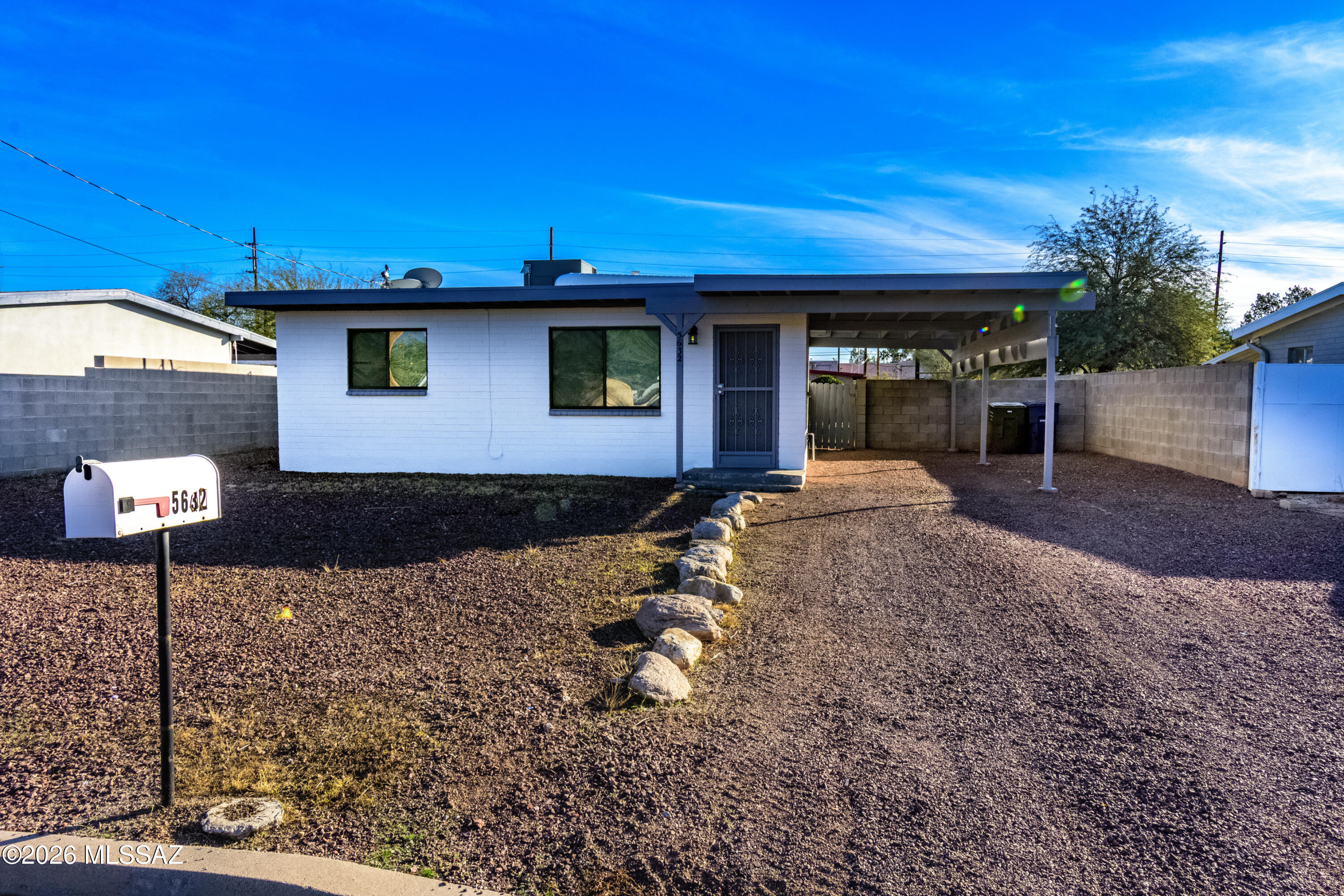 Located in a convenient central Tucson location, this well-maintained residence at 5632 E Mabel Street offers a thoughtful blend of comfort, functionality, and investment appeal. The home features two bedrooms and one updated bathroom, with a bonus/flex space off the primary bedroom, complemented by an updated kitchen and cohesive ceramic tile flooring throughout for a clean, modern feel and easy maintenance. An extended carport provides additional covered parking, while masonry patio walls create a private outdoor setting on the large lot. From the front picture window, enjoy Catalina Mountain views that enhance the home's welcoming atmosphere. Ideal as a first home or an income-producing investment, this property delivers versatility, upgrades, and location in one attractive package.