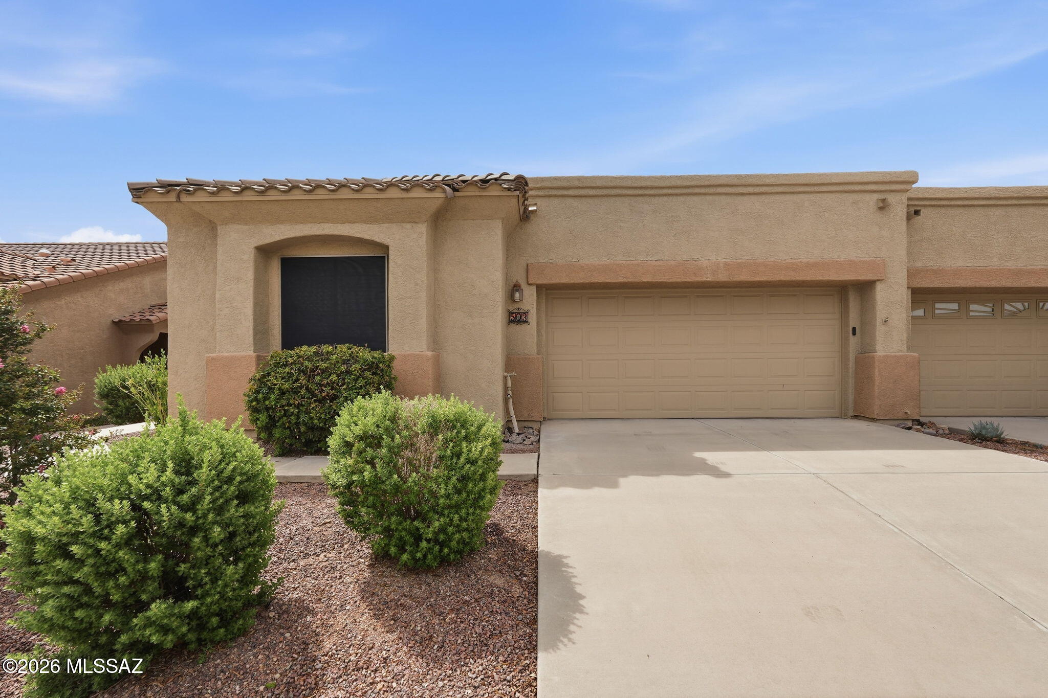 Welcome to 503 W Shadow Wood Street in the desirable gated community of Las Campanas Village. This move in ready open concept-split bedroom floor plan home features 2 BD/2BA ceramic tile throughout, freshly painted interior, laundry room, bay window in dining area, breakfast bar, solar shade screens, extended length garage, and a lovely patio with retractable screens that backs up to the common area and walking path~ a perfect place to enjoy your morning coffee and evening cocktails. The HOA covers trash, cable TV, pest control, roof, exterior maintenance, landscaping, and common areas giving you freedom to enjoy everything Green Valley has to offer. Great for full time resident or winter retreat. Conveniently located to shopping, golf, restaurants, public library and so much more.