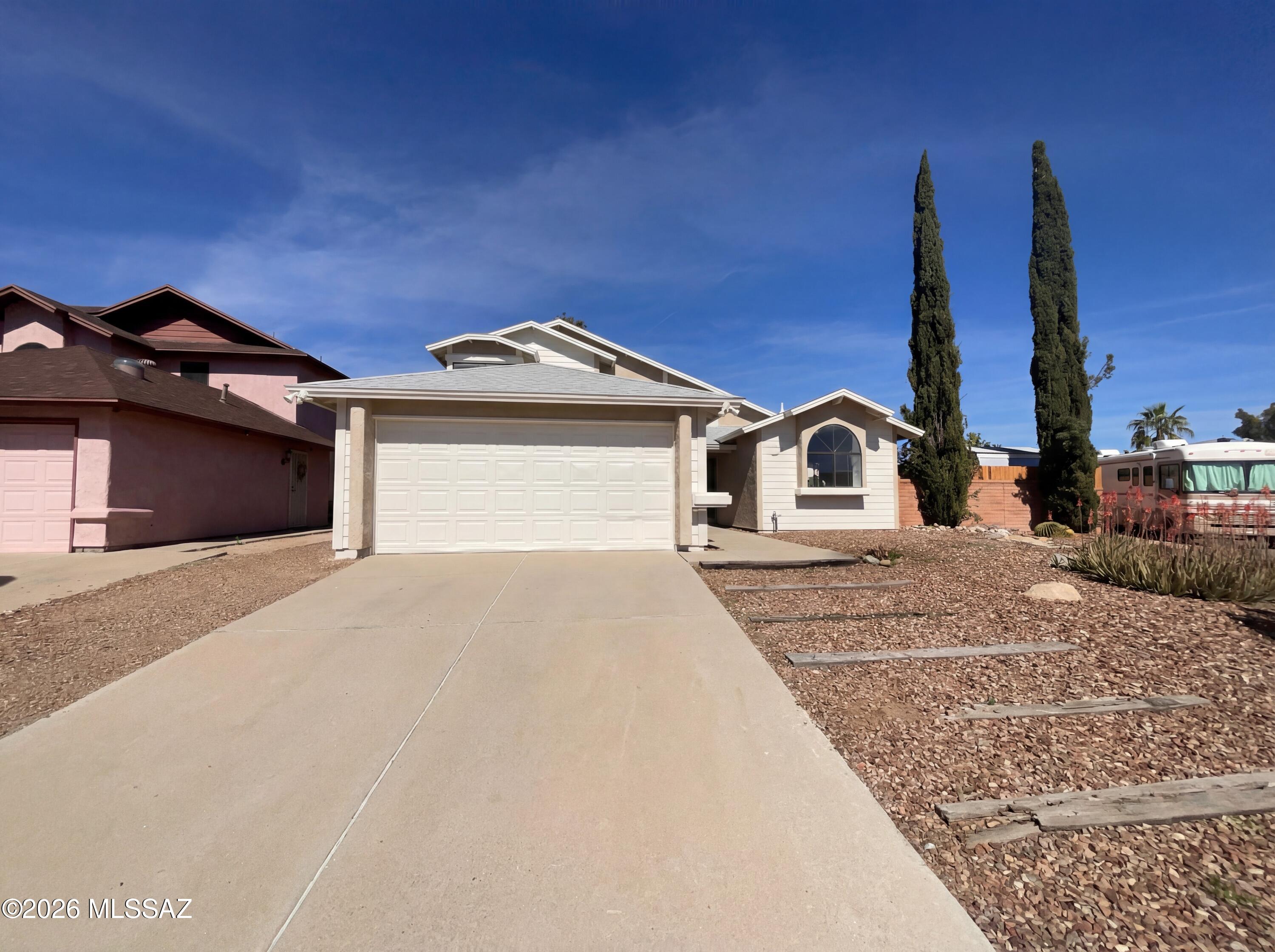 Welcome to 3640 W Koshare Ln, where modern living meets comfort. The kitchen is a chef's dream with an accent backsplash and all stainless steel appliances. The primary bathroom is a sanctuary with double sinks, providing ample space for your morning routine. The primary bedroom boasts a spacious walk-in closet, perfect for all your storage needs. Step outside to a covered patio, ideal for entertaining or simply enjoying a quiet evening. The fenced-in backyard provides private space for outdoor activities. The home has been recently updated with fresh interior paint, giving it a clean and contemporary feel. This property is a perfect blend of style and functionality, making it a must-see. Included 100-Day Home Warranty with buyer activation