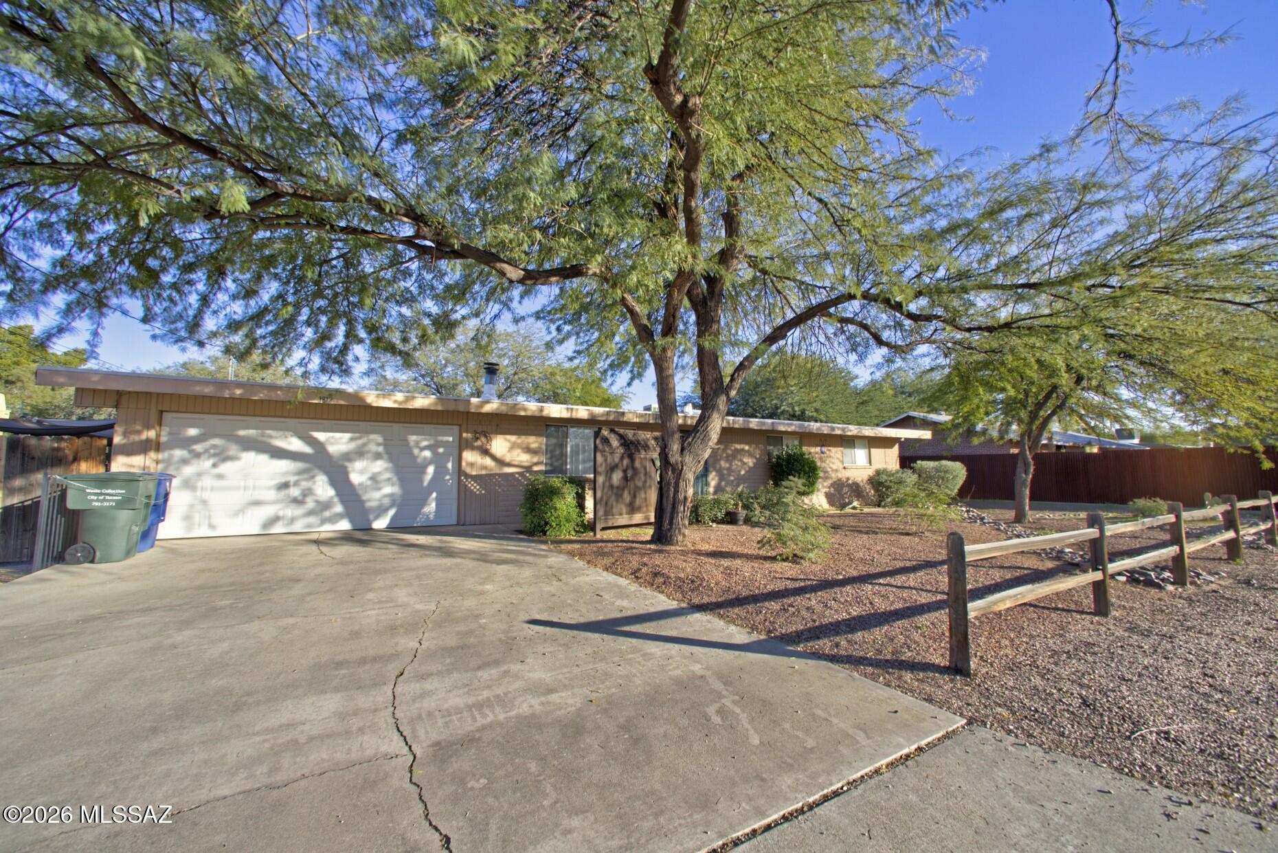 Truly a unique property! Live in one home and rent the other OR enjoy flexible living for multi-generational families, guests, OR short/long-term rental. Situated on a large .28-acre lot in a NO HOA neighborhood, the main home, built in 1971, offers 3 bedrooms, 2 baths, 1,439 sq. ft., 2-car garage, plus a bonus room ideal for an office or den. Double gates on both sides provide added access and  room for small RV. The detached 1,122 sq. ft. casita, built in 2001, features 2 bedrooms, 1 bath, full kitchen, and laundry. Both homes have brand-new HVAC systems with warranty and 2 years of service. Ducts were also cleaned. Conveniently located close to Tucson Medical Center!Total of 5 bedrooms, 3 baths, two kitchens, two separate living spaces, this is a rare opportunity with SO much potential! Brand-new HVAC/furnace in guest house too.  Ducktwork has also been professional cleaned in both homes. Create income while enjoying the flexibility of two residences!