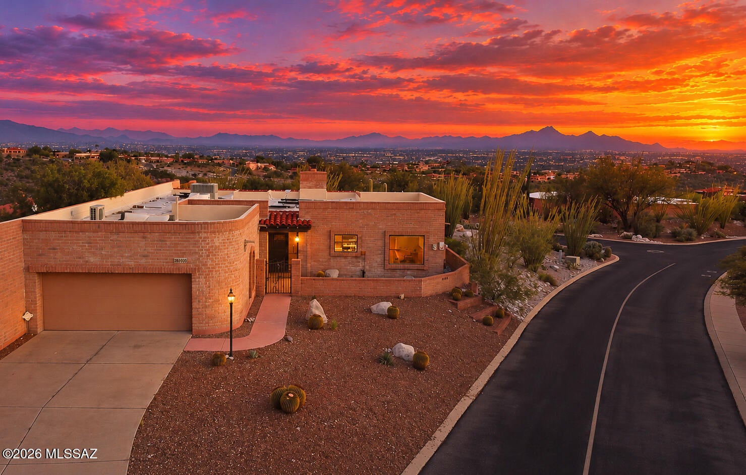 Looking for a townhome with unexpected privacy & serenity that's elevated, almost 1/4 acre lot, mountain views, city lights,  north/south orientation, and SELLER OWNED solar, look no further!  As you enter the long driveway you're greeted by a private courtyard. Once inside you'll find a HUGE open floorplan with skylights, airy kitchen, multiple dining areas, a wet bar, butler's pantry, fireplace, 3 bedrooms and rare 2.5 baths. The home has four sliding glass doors for access to the wrap around covered patios which creates a seamless indoor-outdoor living space. There's even remote roller shades and misters for those hot summer days. For a WOW factor, garage has ladder to roof access for incredible sunsets & twinkling starry nights. The location is superb with minutes from Sabino Canyon hiking trails, Ventana Canyon golf course, grocery stores, schools, athletic facilities, and the vast array of dining options. Best of all you have the community pool, spa and tennis courts.