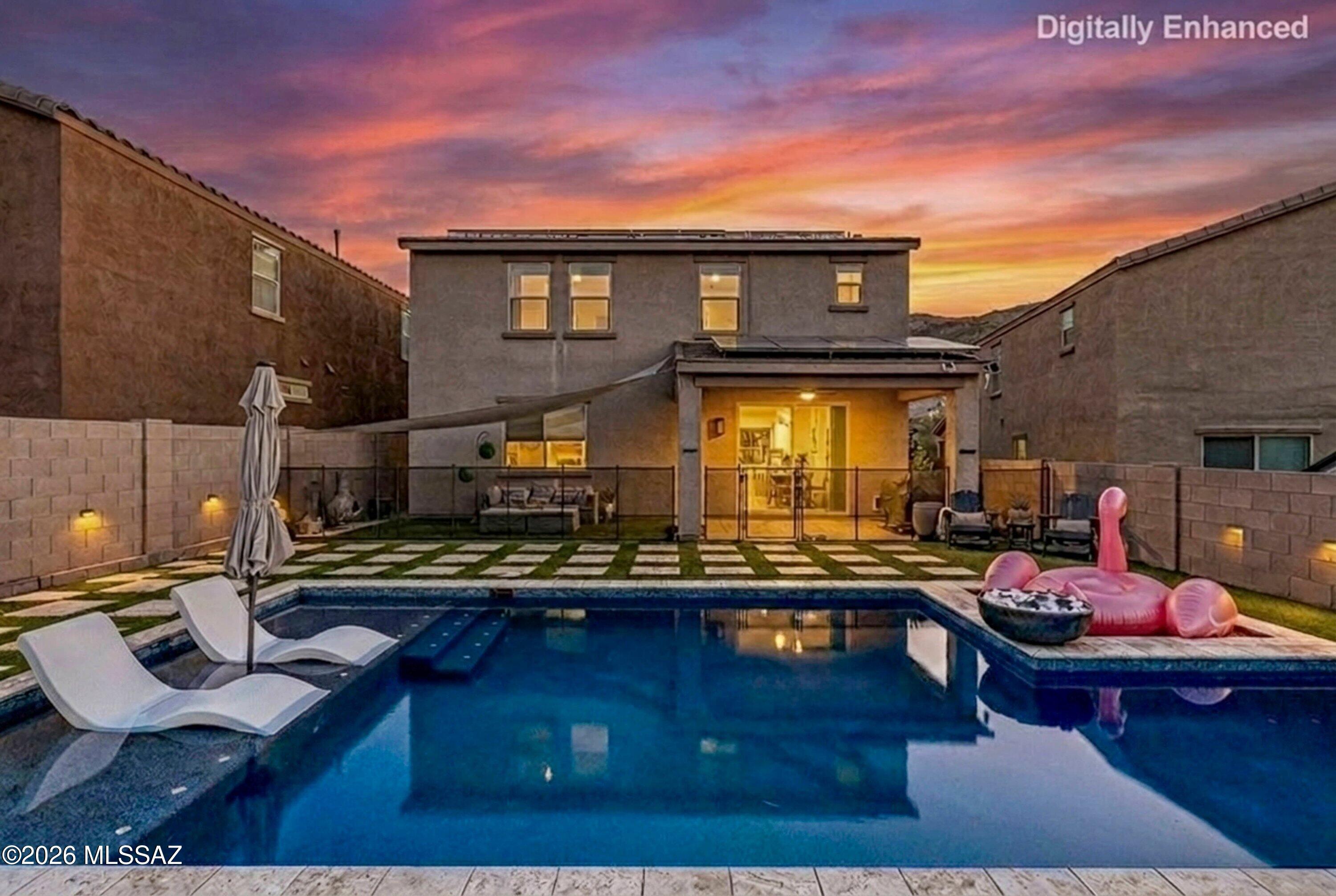 Heated, saltwater pebble tech pool, owned Solar, beautiful custom primary closet, and so much more..

Better than new,  this remarkable home offers the perfect blend of elegance, comfort, and resort-style living. Designed with Arizona living in mind, the owned solar panels provide incredible energy efficiency and help power your stunning heated Pebble Tec saltwater pool , complete with self-cleaning system, tanning ledge, and Pentair control system for effortless enjoyment year-round.
With no rear neighbors, you'll enjoy added privacy while relaxing in your very own backyard oasis, all while being surrounded by incredible resort-style community amenities.

Inside, the home is move in ready and thoughtfully designed with upscale custom features throughout. The first-floor office provides the perfect flex space for working from home or additional living needs. The spacious living area showcases a custom oversized electric fireplace that creates a warm and sophisticated focal point. Throughout the home, you'll find custom paint,  beautiful flooring with no carpet, giving the space a clean, modern, and updated feel.

Upstairs offers a spacious loft, convenient second-floor laundry room, four generously sized bedrooms, and a showstopping custom primary closet that feels straight out of a luxury magazine. From the elegant finishes to the extensive upgrades and attention to detail, this home offers exceptional value and a truly move-in ready experience. Every inch of this home has been beautifully maintained and thoughtfully enhanced , a rare opportunity you will not want to miss.