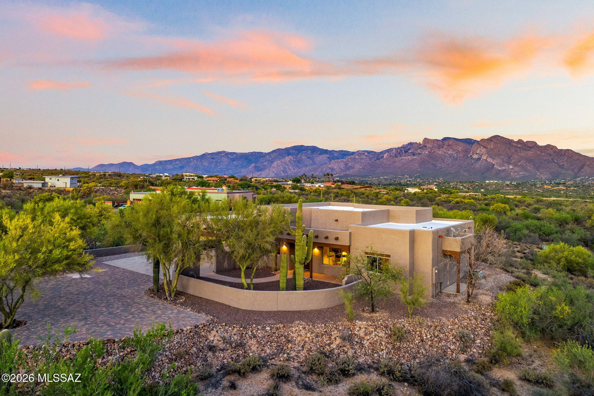 Custom built 4 bedroom 3 bath home on 3.57 acre parcel offering wide open desert vistas and panoramic views of the Catalina Mountain range. thoughtfully laid out with abundant natural light.Open, bright and inviting great room features the warmth of wood and beamed ceilings which opens to the kitchen w/custom oak cabinets, granite counters, stainless steel cabinetry, stainless steel appliances, and attractive breakfast bar. Split bedroom plan~primary bedroom w/large walk in closet, mountain views~primary bathroom w/ dual vanities, jetted tub, separate walk in shower. Features throughout include recessed lighting, ceiling fans, 6 panel doors, abundant storage. Large covered patio with rustic wood beams enhance the feeling of  genuine comfort.  Peaceful, quiet, and serene setting. No HOA!