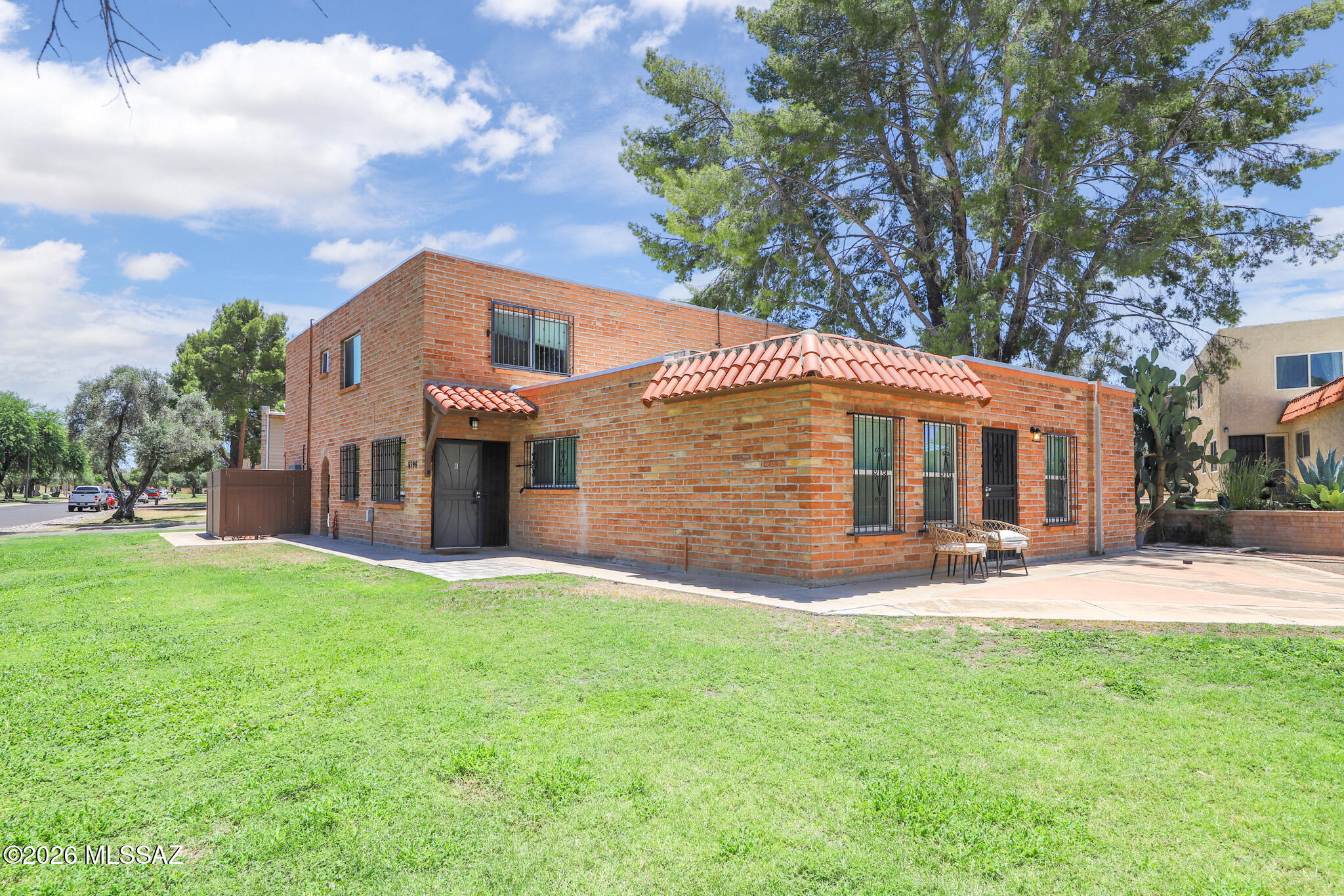 Welcome home to this beautifully remodeled townhome in sought-after Northeast Tucson! Located in the Sabino High School district and just minutes from Udall Park, where you'll enjoy walking trails, fitness classes, a pool, pickleball, and more. Inside, the home features wood-look laminate flooring throughout, ceramic tile in the kitchen and bath, all appliances, and a bright, modern feel.  Attached carport with storage, and enjoy the convenience of on-site laundry. Community amenities include a sparkling pool, while the HOA covers water, landscaping, and common area maintenance for easy, low-maintenance living.