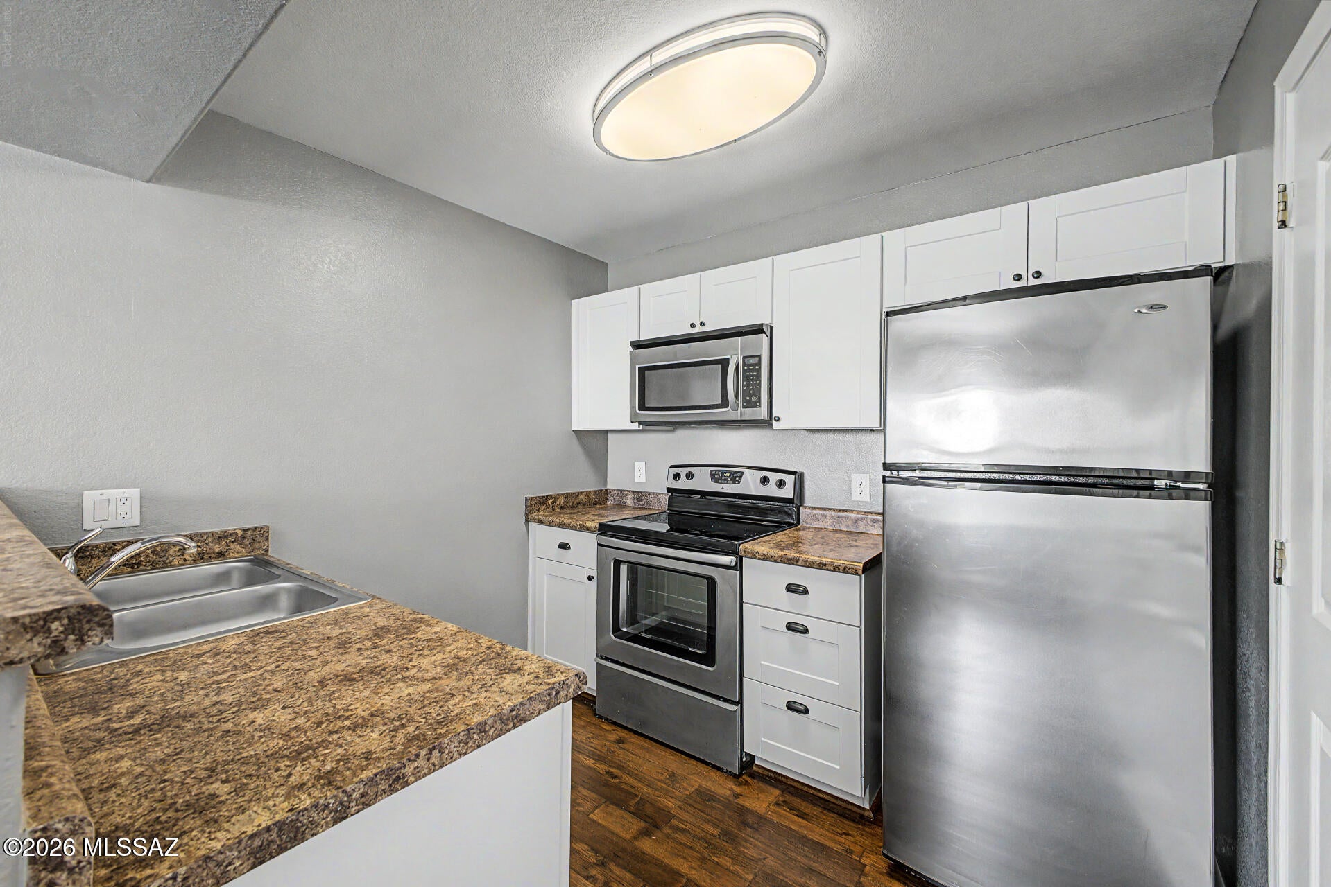 Your Catalina Foothills Retreat Awaits! Nestled at the base of the Catalina Mountains, near the renowned Ventana Canyon Resort, this first-floor corner condo offers a wonderful combination of privacy, convenience, and resort-style living. Tucked away from busy streets and pool activity, yet just a short walk to one of the community's sparkling pools, its peaceful setting is a standout feature. Inside, enjoy continuous flooring throughout with no carpet, updated cabinetry in the kitchen, a spacious walk-in closet, and a full bathtub for added everyday convenience. With an inviting layout and easy-care interior, this home offers a comfortable retreat you can enjoy as-is or personalize over time. Hiking enthusiasts will appreciate nearby Sabino Canyon and scenic desert trails, while golfers will love the area's exceptional courses. Whether you're seeking a full-time residence, seasonal winter getaway, or foothills escape, Veranda at Ventana offers the opportunity to enjoy the best of Tucson's outdoor lifestyle. Vacant and easy to see--come discover this peaceful corner of the Catalina Foothills!