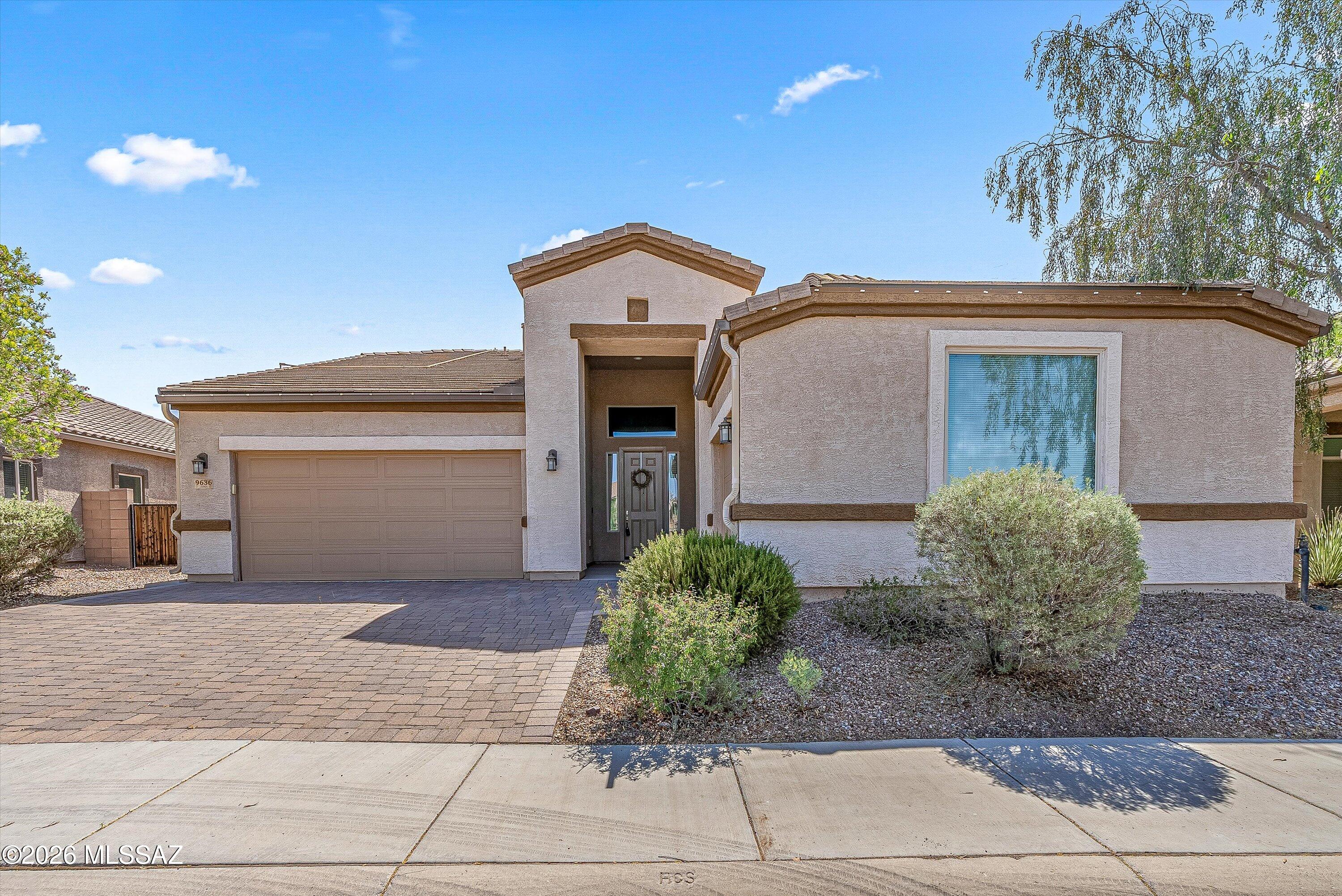 This move-in ready Saguaro Bloom home offers owned solar plus up to 3% in buyer concessions with acceptable offer, creating immediate value and lower monthly utility costs. The versatile floorplan features 4 bedrooms plus a bonus room/den, while a Jack-and-Jill bath connecting two secondary bedrooms adds functionality for family, guests or multi-use living. High ceilings, abundant natural light and an open-concept design create a spacious feel throughout the main living areas and kitchen. Enjoy a fully finished backyard with artificial turf and room to personalize with your favorite plants. Three garage spaces provide exceptional storage. Ideally located across from one of the community parks in Saguaro Bloom with access to pools, walking paths and neighborhood amenities.