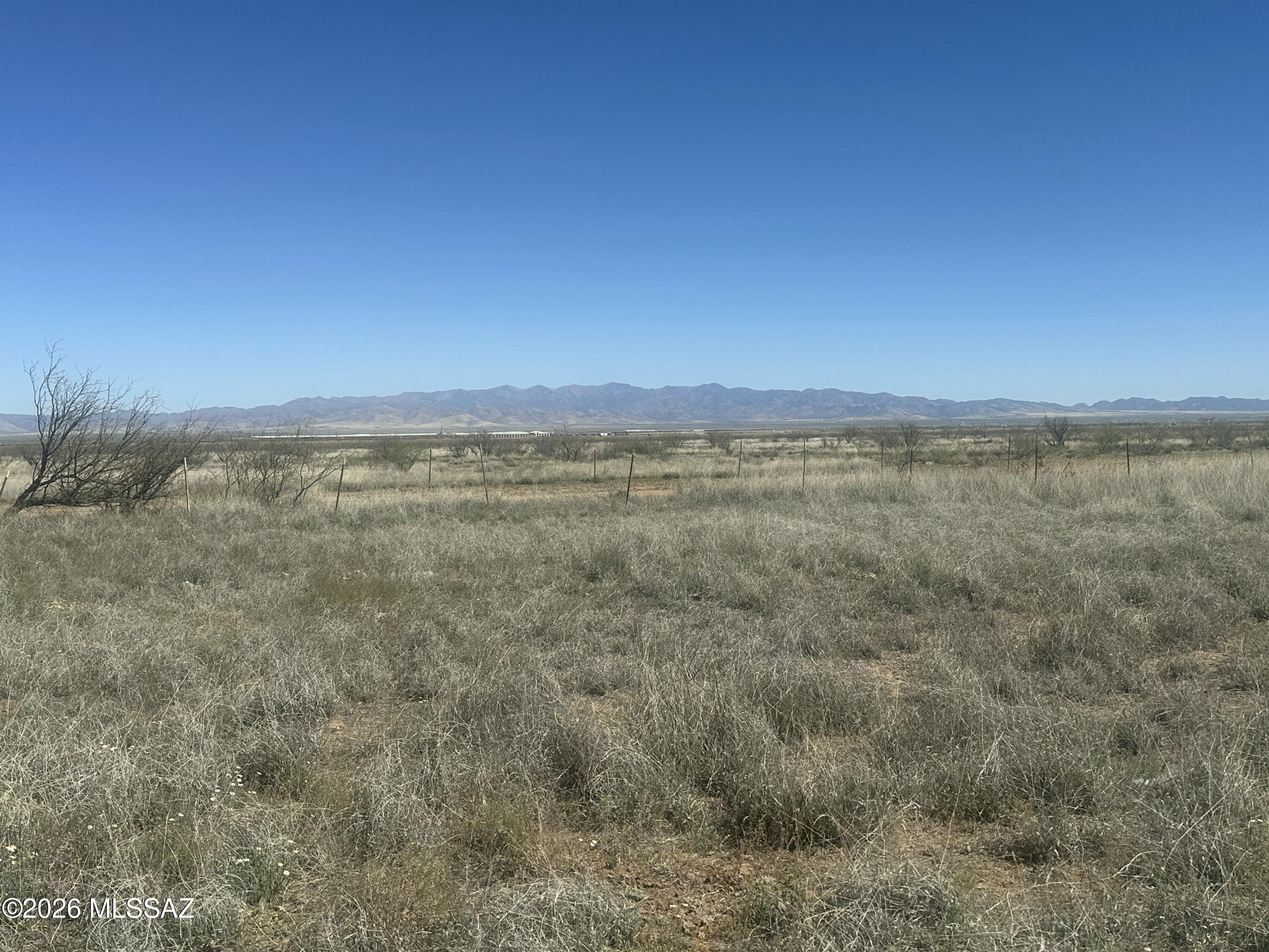 The sale includes three parcels: 401-01-057, 401-01-067A (19.546 acres), and 401-01-067B (19.546 acres), totaling 78.183 acres of beautiful vacant land. One parcel (39.09 acres) features a newly drilled well, adding great value and future potential. The property offers natural desert vegetation, including cacti, mesquite trees, and native grasses, and is partially fenced with access from both the east and west sides. A house/storage structure with strong potential is on site, along with an old septic tank that is no longer connected. Ideal for farming or agricultural use, the land offers peaceful rural surroundings, an active ranch to the east, and stunning Dragoon Mountain views to the west.