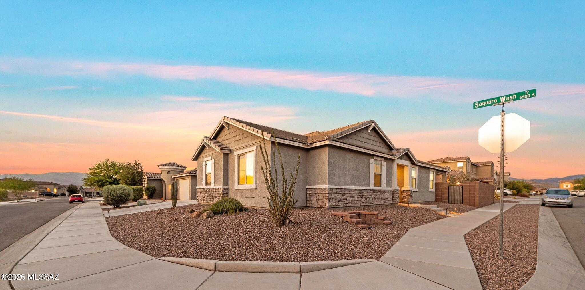 Range Priced-Seller will accept/or counter offers b/w $465,000 & $500,000. ASSUMABLE LOAN at 2.250% VA Loan ($249,700 balance, maturity 8/2051, monthly payment is $1,617.50 PITI )!! Showcasing modern designer finishes, this home offers 4 bedrooms plus a separate office/den that can easily convert to a 5th bedroom. Stunning kitchen with a custom subway-tile backsplash & a large island ideal for gathering. Oversized bedrooms and impressively large bathrooms enhance everyday comfort. The backyard features artificial turf, pavers, raised flower beds, and an extended natural-gas line with two outlets for a grill and flat top. The hobby ready 3 car, tandem garage w/extra spliced outlets & workbench. Corner lot. The home feels open, bright, and thoughtfully designed throughout. Saguaro Trails is an elegant and amenity-rich Tucson community nestled up near the Rincon Mountains and offers plenty of opportunities for recreation, adventure, and exploration. Homeowners have access to A-rated schools and close proximity to restaurants, shopping, medical facilities and easy access to I-10 & downtown Tucson. The community is connected to The Loop and Fantasy Island trail systems (two of Tucson's premier biking systems) and is only a few miles from Colossal Cave Mountain Park and the world-renowned Saguaro National Park - all of which offer excellent cycling and hiking trails as well as spectacular sightseeing.
Within the Saguaro Trails community, homeowners enjoy a 7-acre amenity park featuring a resort-style pool with a beach entrance perfect for cooling off after a day of hiking in the desert. The park also features a splash pad, sports court, playground, dog park, and so much more. Picturesque views and an abundance of surrounding nature trails, Saguaro Trails offers the best of desert living.