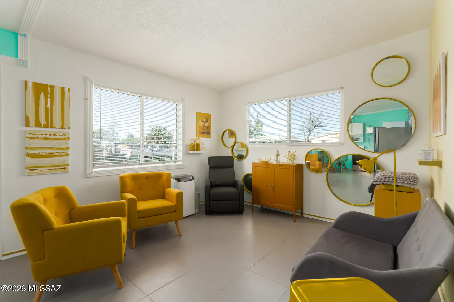 Extraordinary artist-created home for sale! Don't miss this beautiful one bedroom, one bath residence. The property boasts a new refrigerator and bathroom, and sits on a large lot in a multifamily plot. Electrical setup is complete for future development. Located centrally in Tucson, this property offers immense potential. The owner is open to leaving the furnishings, making it a turnkey opportunity for Airbnb investors.