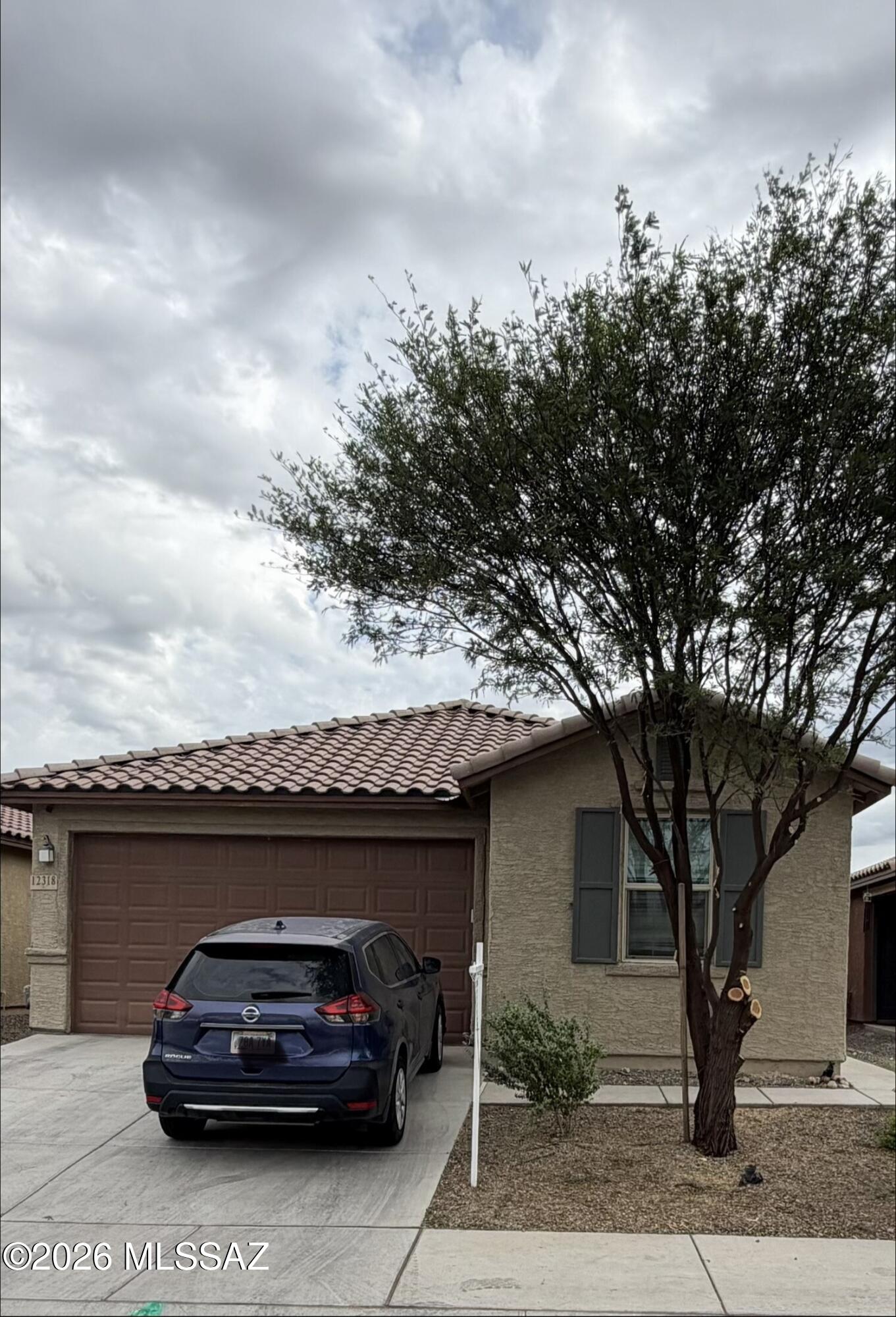 Experience space, privacy, and scenic views in this inviting Gladden Farms home, offered at $385,000. The thoughtfully designed 2,005-square-foot floor plan features 3 bedrooms, 2 bathrooms, and a versatile den--ideal for a home office, playroom, or hobby space. Both bathrooms offer dual sinks for added convenience. The kitchen opens to the spacious great room and features stainless-steel appliances, creating a comfortable setting for everyday living and entertaining. Carpet and tile flooring run throughout the home. The refrigerator, washer, and dryer will convey with home. Additional highlights include a separate utility room and attached two-car garage. With no rear neighbors, the backyard offers enhanced privacy and beautiful views.