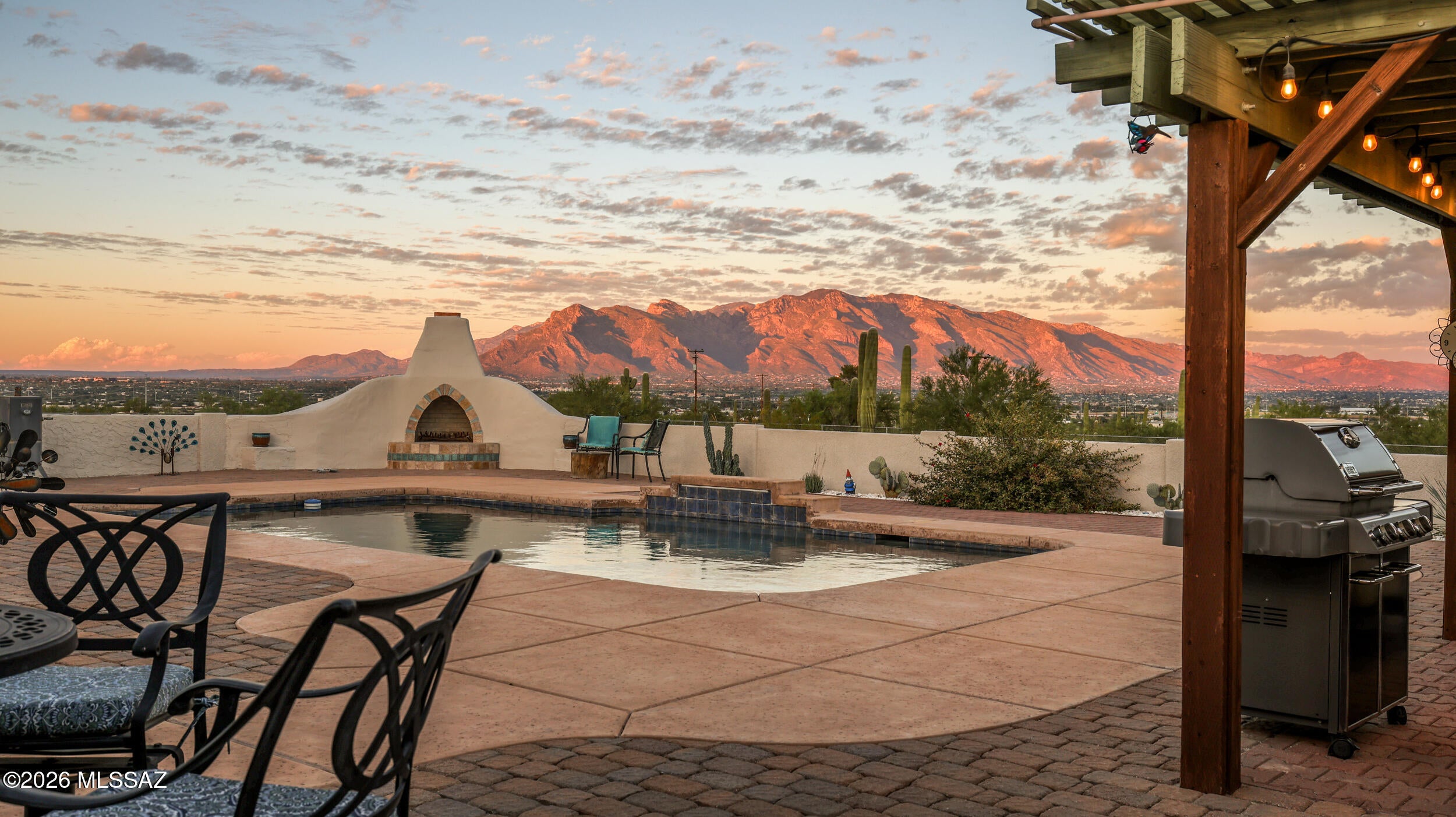 Looking for privacy, views, and space? Welcome to your own slice of the Sonoran Desert! Situated on almost 4 acres, this 3 bedroom 2 1/2 bath home offers room to roam, panoramic views of the Catalina Mountains and spectacular sunrises and sunsets. Enter thru the charming courtyard into an expansive living room featuring a wet bar/coffee bar perfect for entertaining. The kitchen boasts granite countertops, a breakfast bar, adjoining dining area and large, walk in pantry. Ductless heating and cooling provides individual room temperature control for personalized comfort and potential energy savings. Step outside to discover what Tucson living is all about! Take a dip in the pool. Pick fresh fruit off your trees. Collect water from your rainwater collection cistern. Enjoy your hobbies in the separate workshop. Want horses? Room to build your own stalls and barn. Oversized 2 car garage has plenty of space for your toys. Enjoy the peace, privacy and open space of desert living while remaining just minutes from I-10, shopping and restaurants.